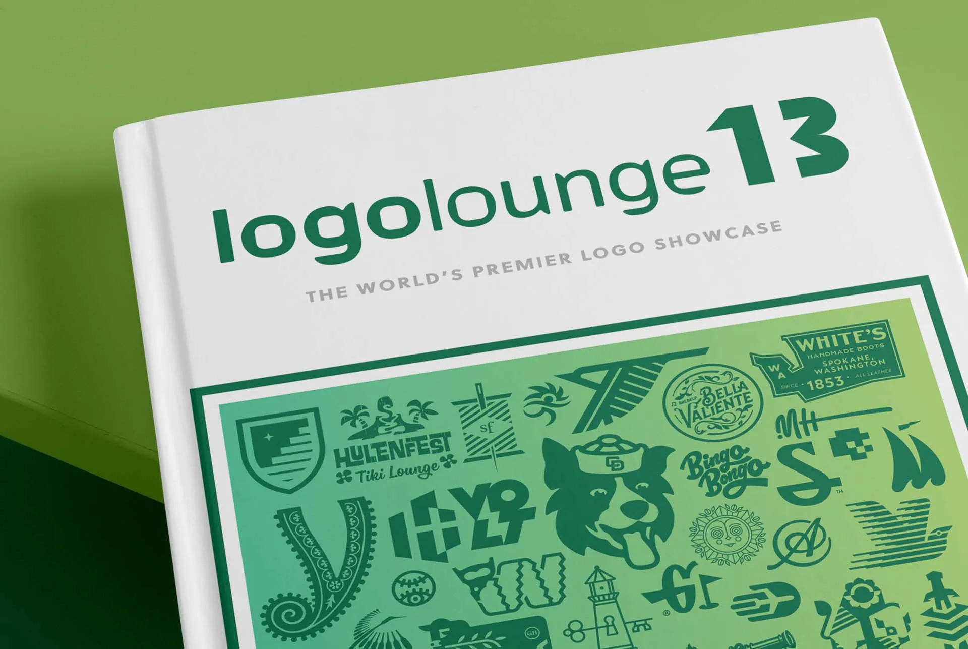 The LogoLounge 13 annual, its green cover printed with a grid of logos