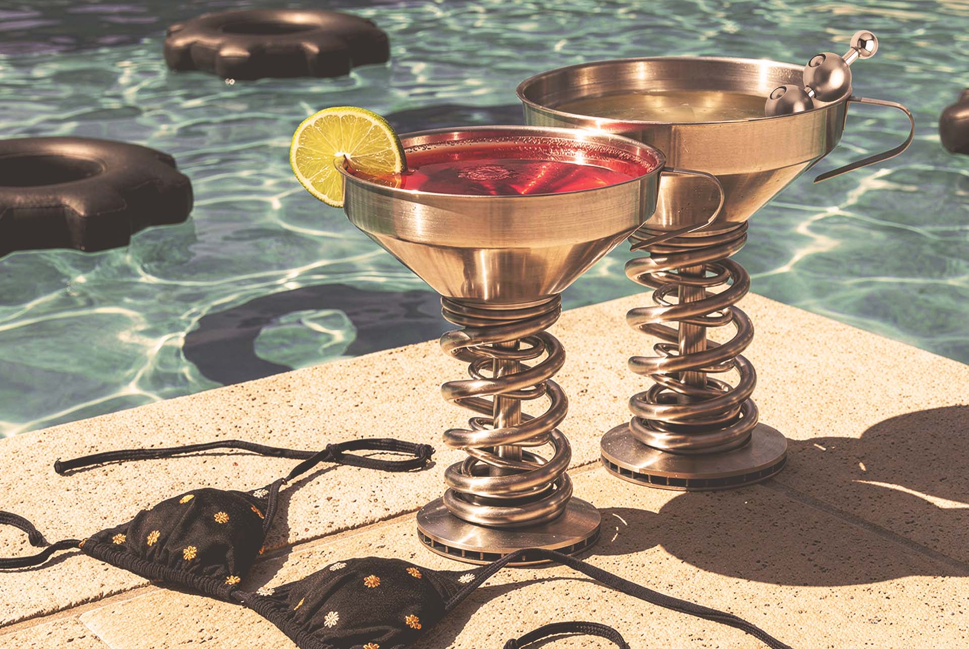 Gearbox metal drinkware in a garage-bar lifestyle scene