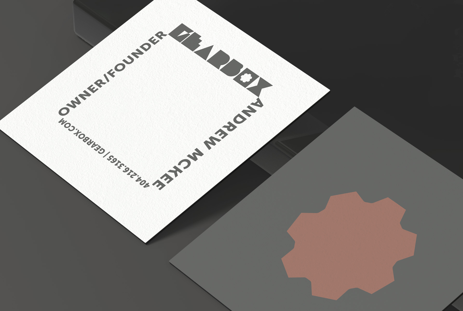 Gearbox letterpress business card with the wordmark and cog rosette mark, brand identity design