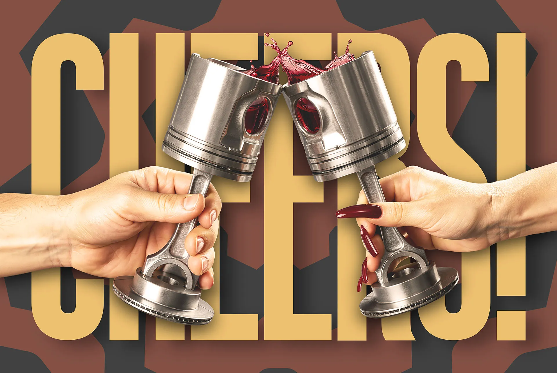 Two hands clinking Gearbox piston wine glasses, red wine splashing, with CHEERS set large behind them