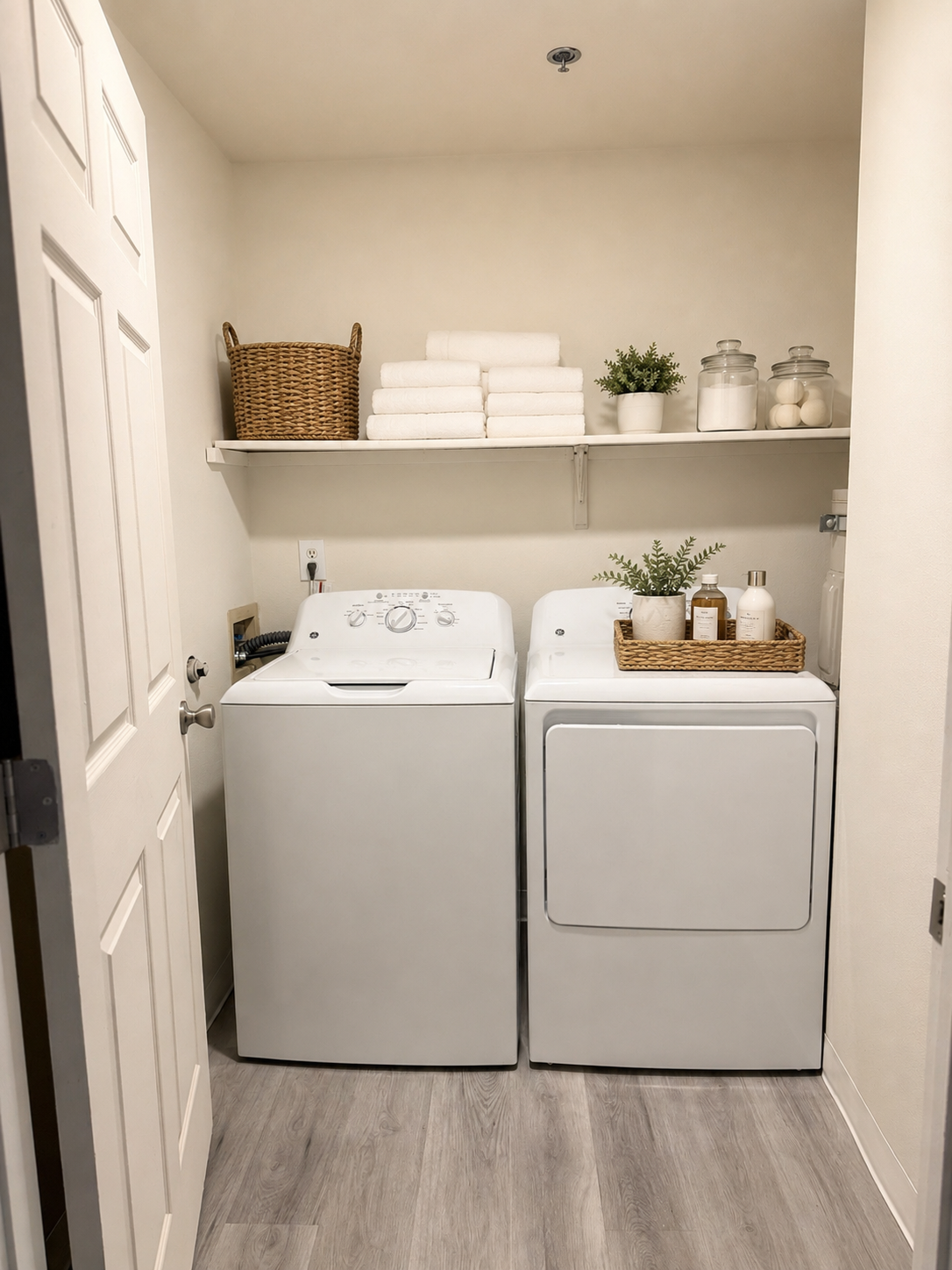 Laundry room with white appliances