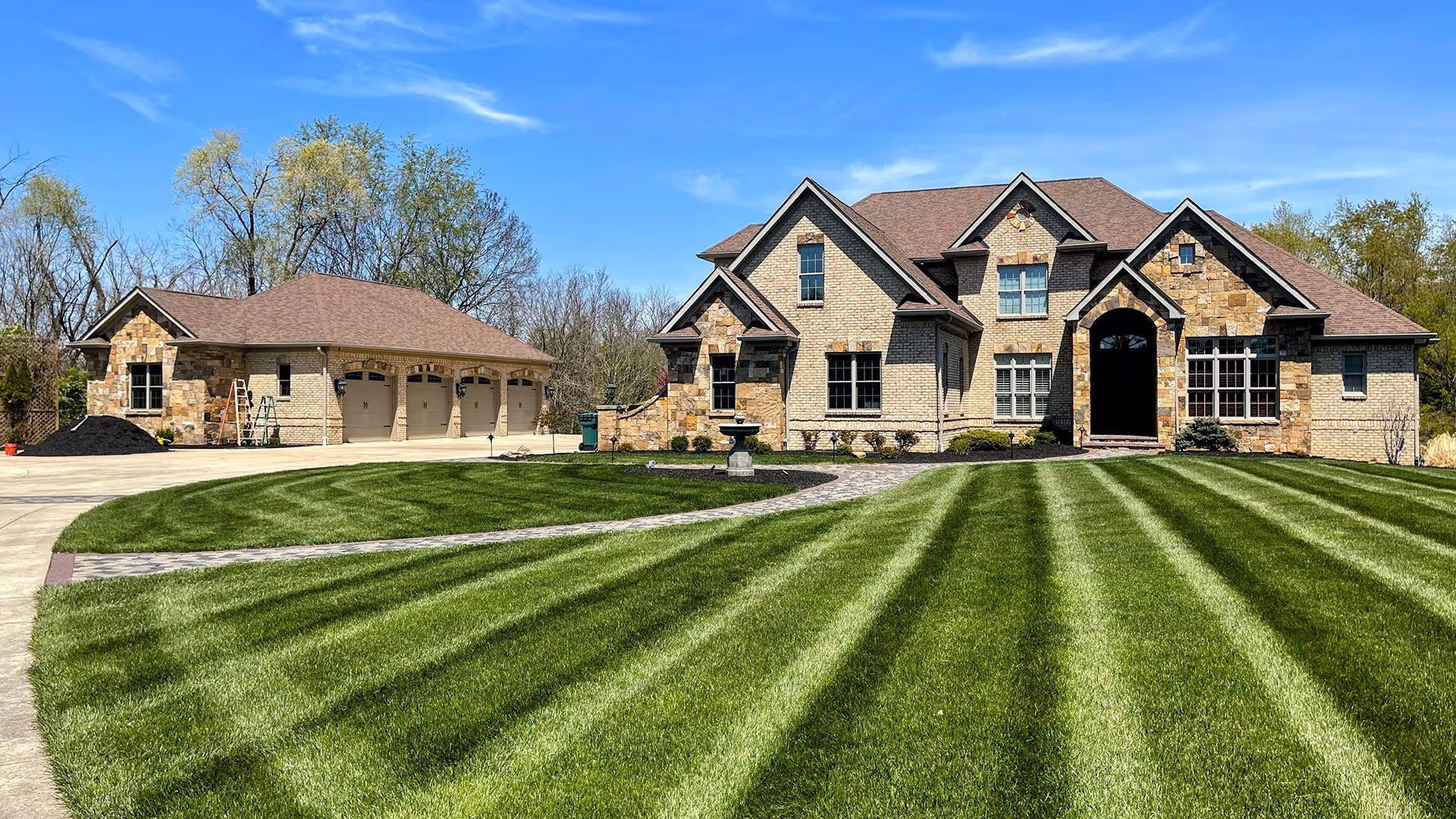 Lawn edging along driveway for sharp curb appeal results