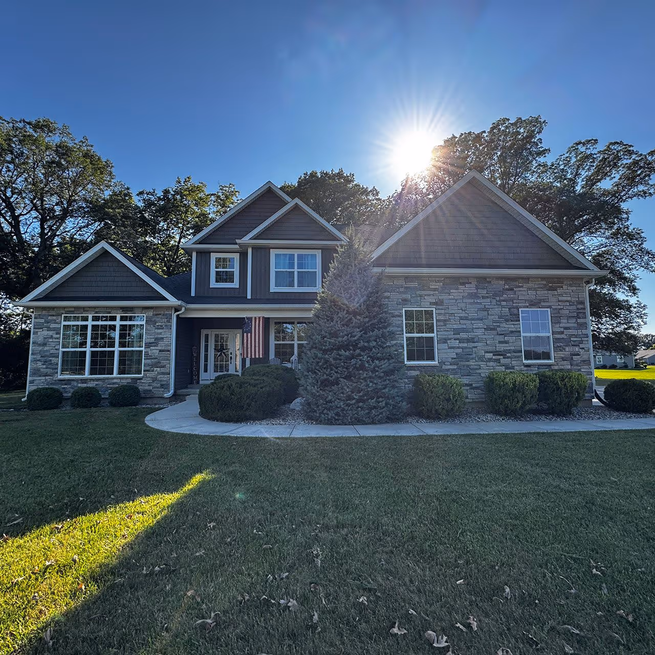 Green, healthy lawn maintained with routine care and treatments