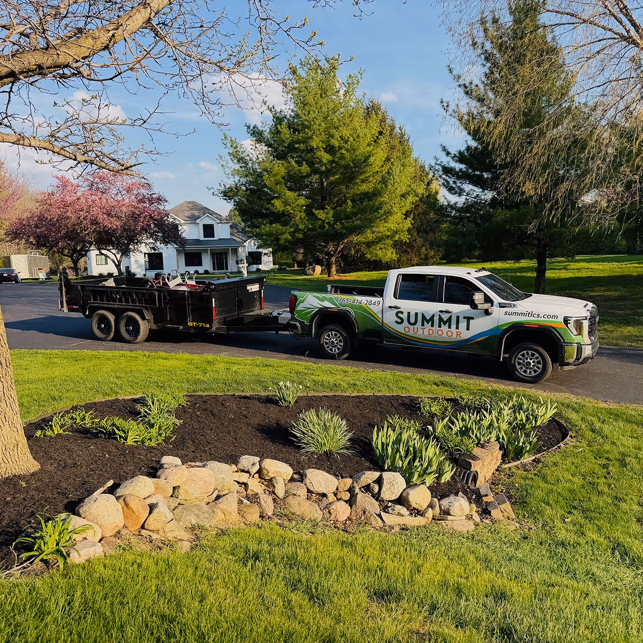 Lawn care team performing professional landscaping services