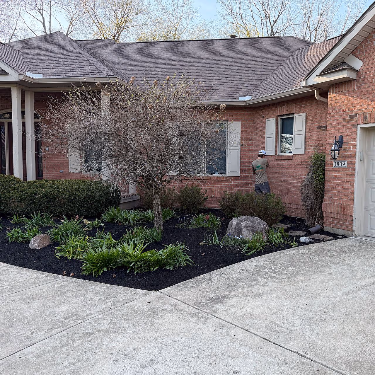 Landscape design and installation with mulch beds and plantings