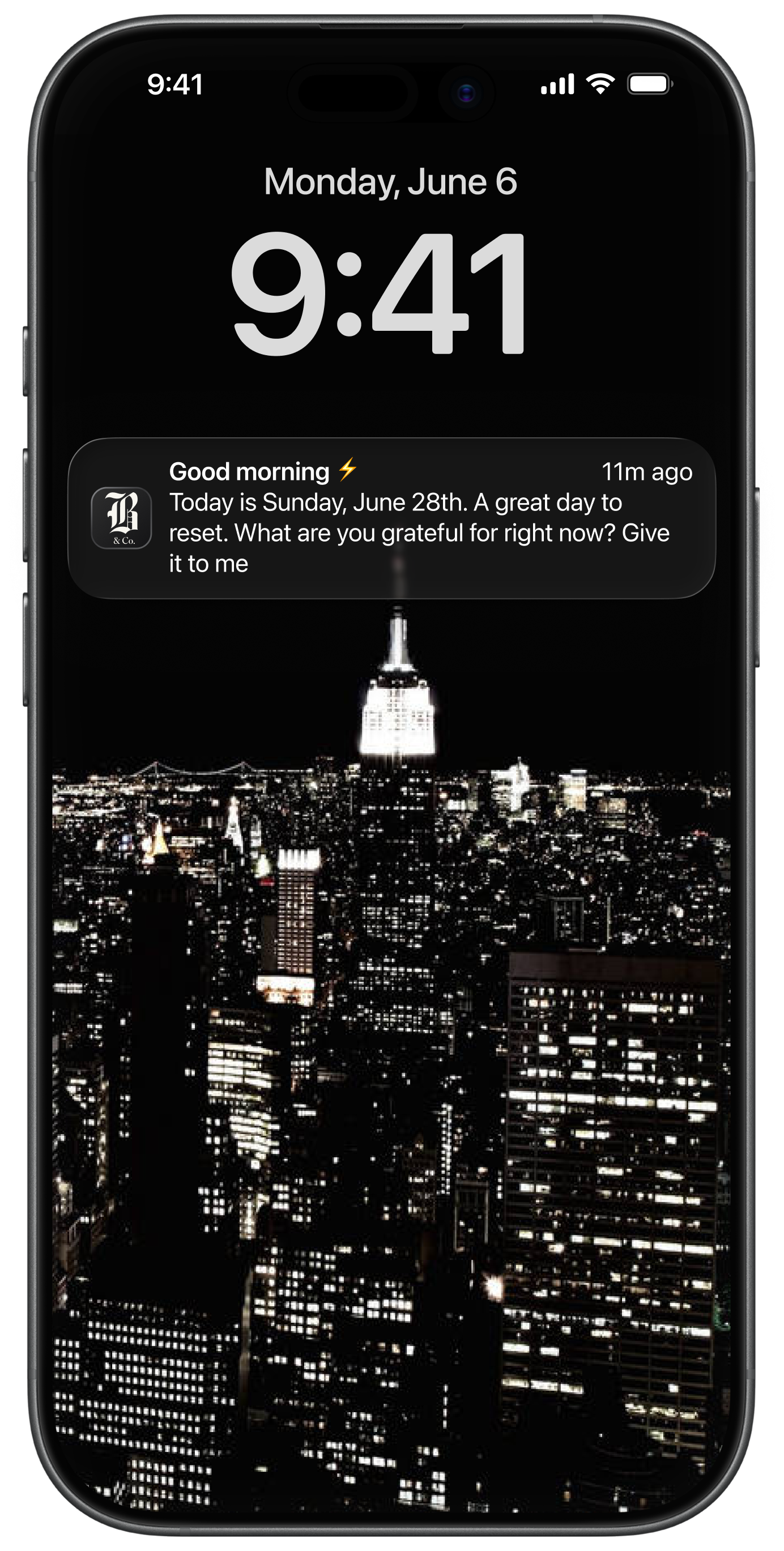 iPhone lock screen with night city skyline and a notification about gratitude and resetting the day.