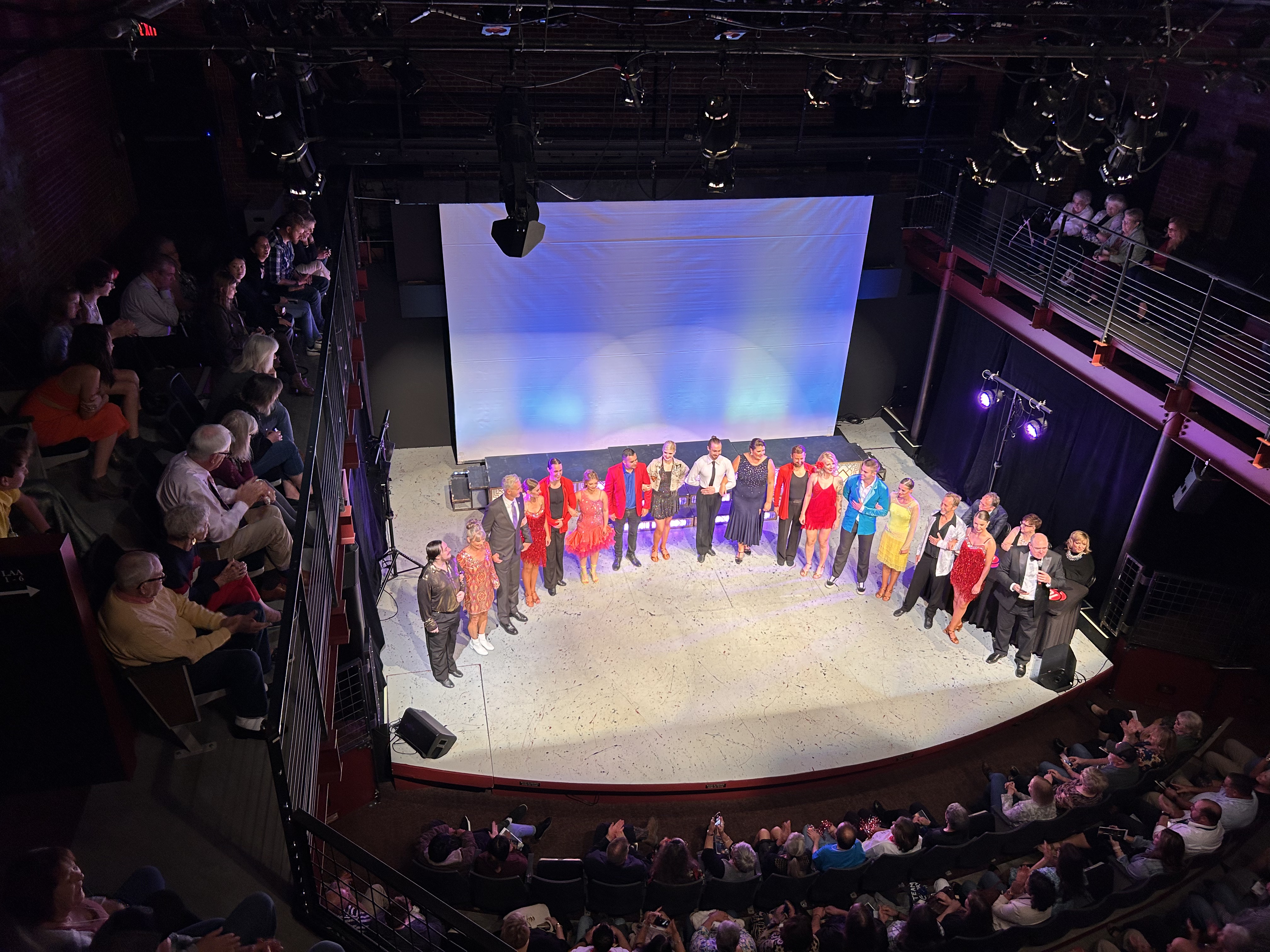 Full cast group photo on stage