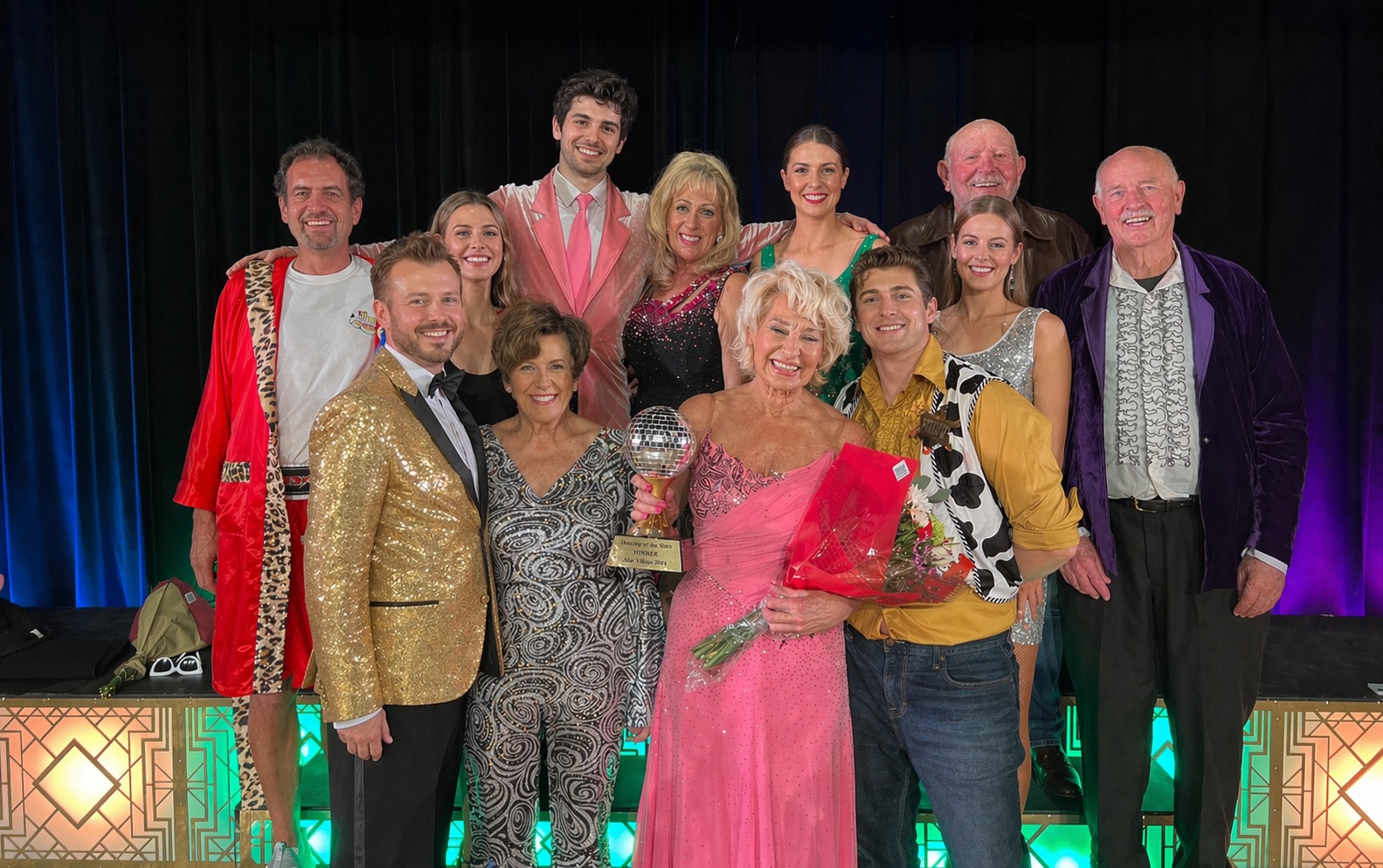 Full cast with mirrorball trophy — show night celebration