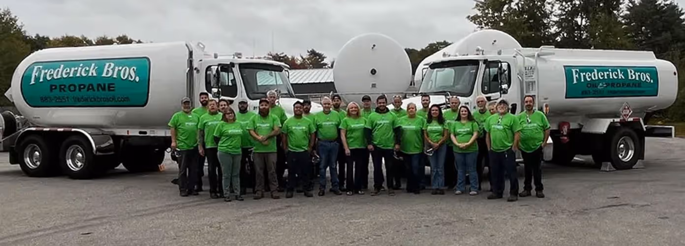 Fredrick Brothers team in front of delivery trucks