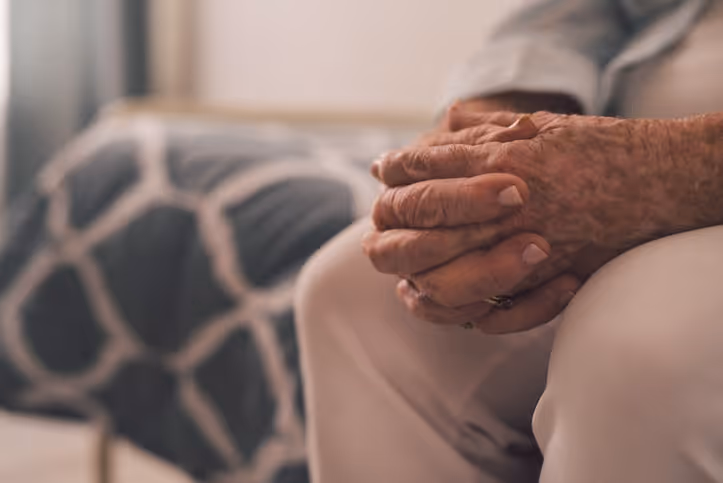 Elder Abuse Attorney in Orange County|A nervous elder patient is shown being consoled by a concerned nursing home staff member.