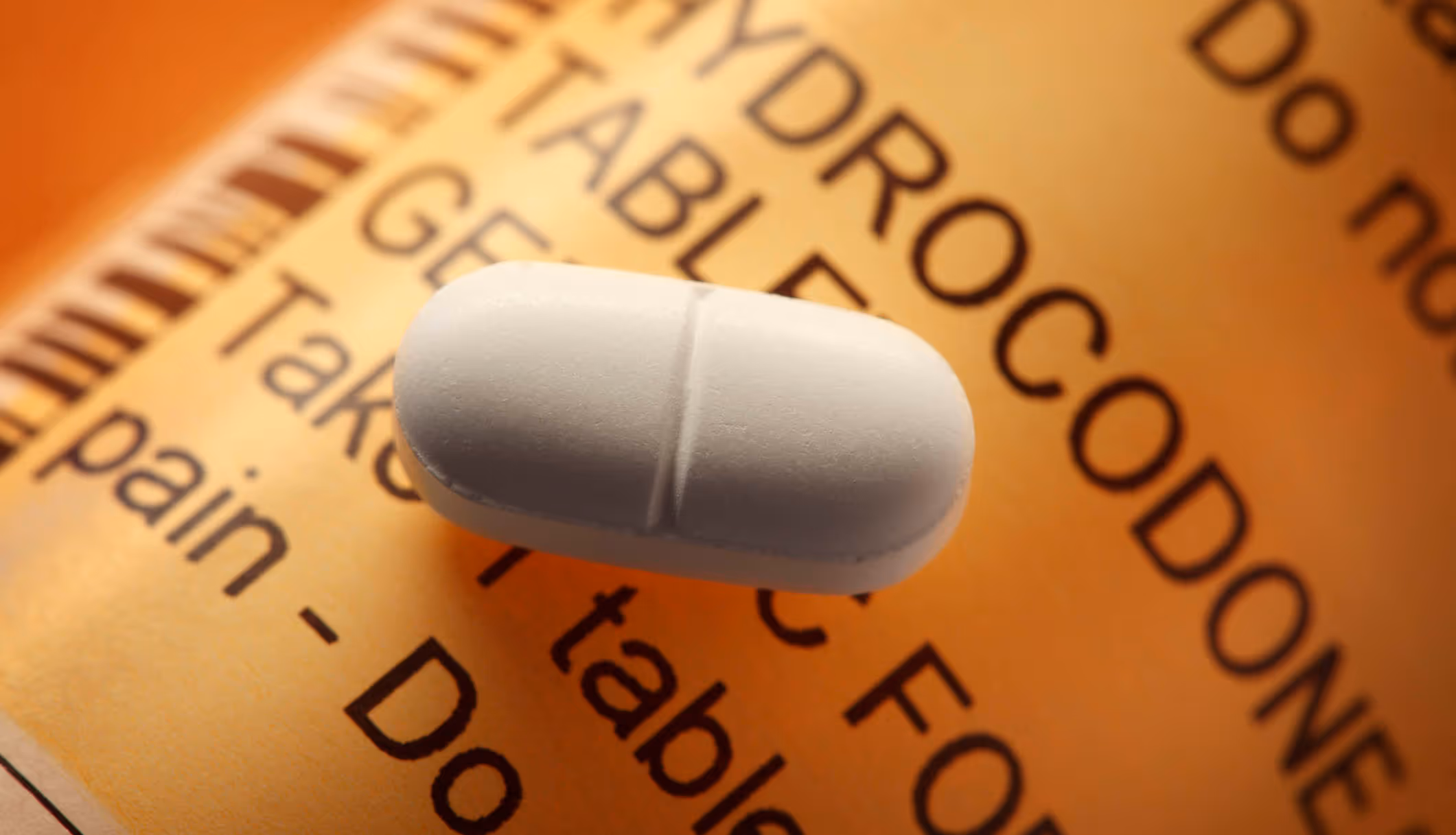Opioid Pill On A Hydrocodone Prescription Pill Bottle|Opioid Pill On A Hydrocodone Prescription Pill Bottle|Opioid Pill On A Hydrocodone Prescription Pill Bottle