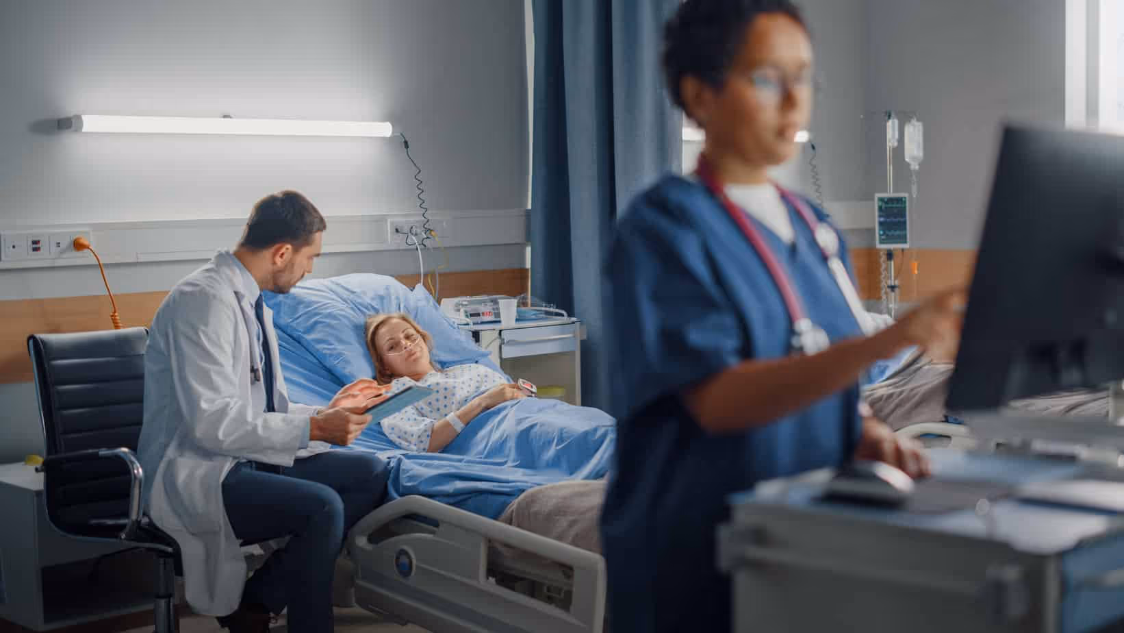Patient with doctor and nurse who needs a Hospital Negligence attorney.|badge-super-lawyers