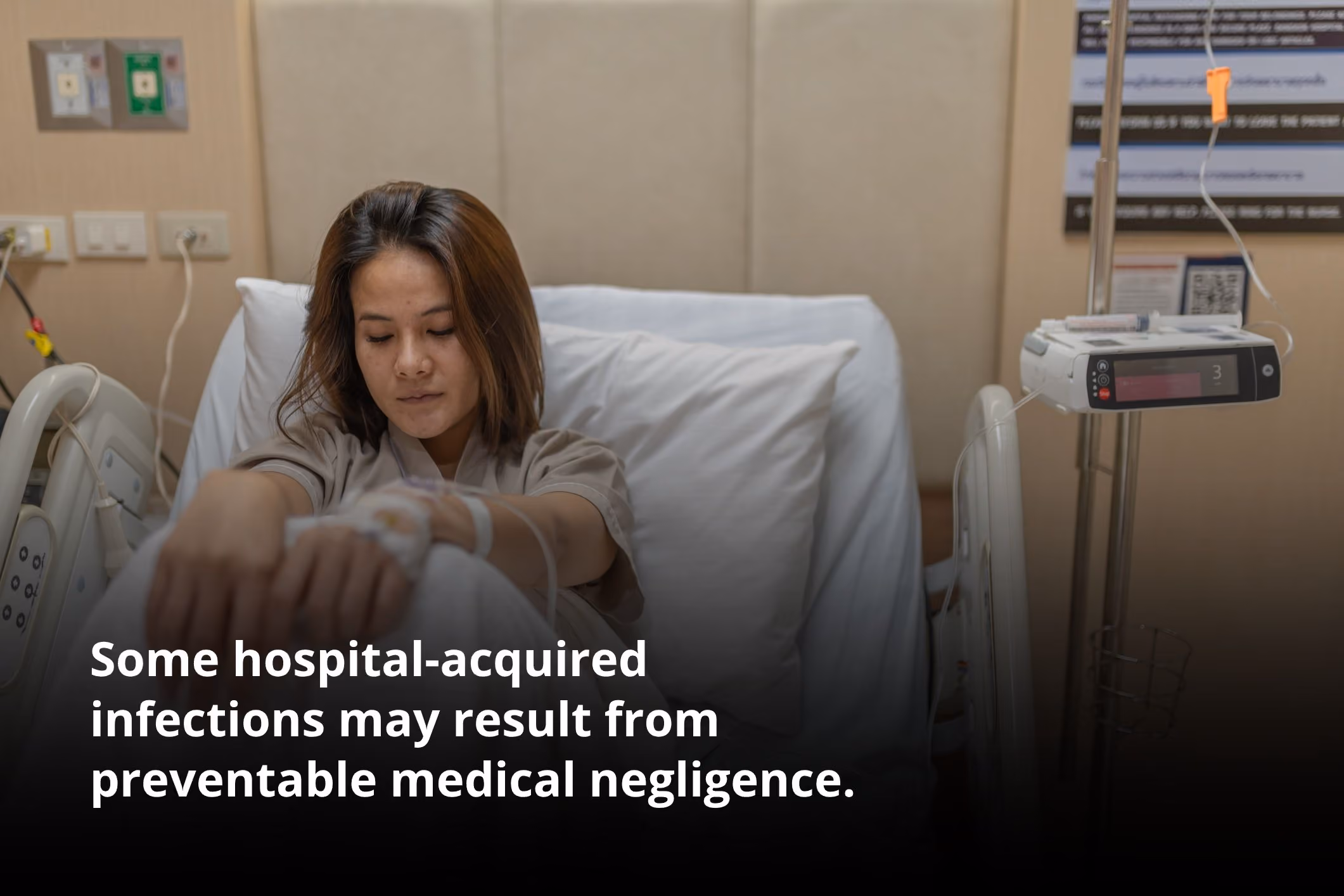 Sick woman waiting in a hospital bed for an Irvine hospital infection lawyer.