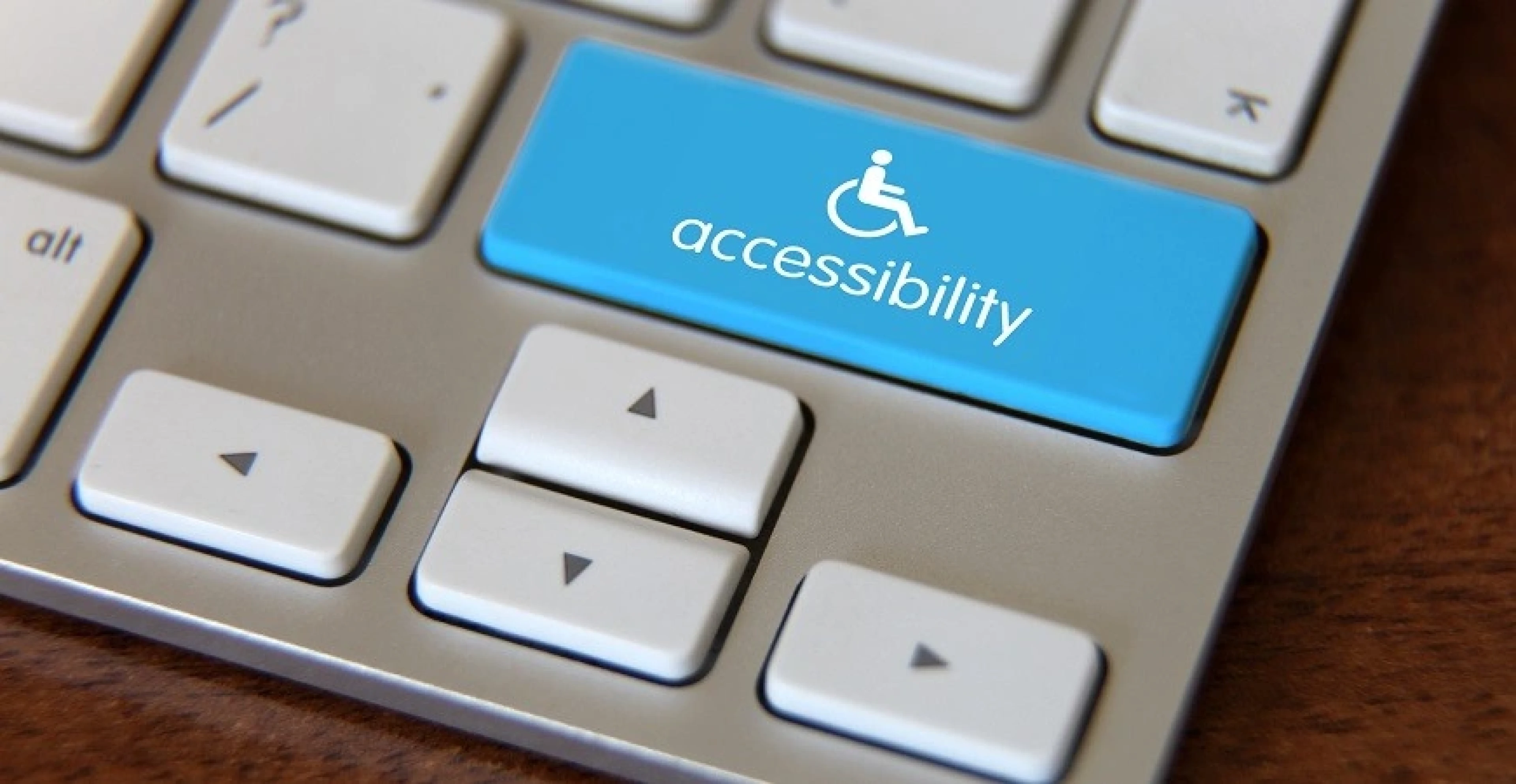 Person typing on a keyboard completing an identity-verified online assessment, supporting BIPA compliance