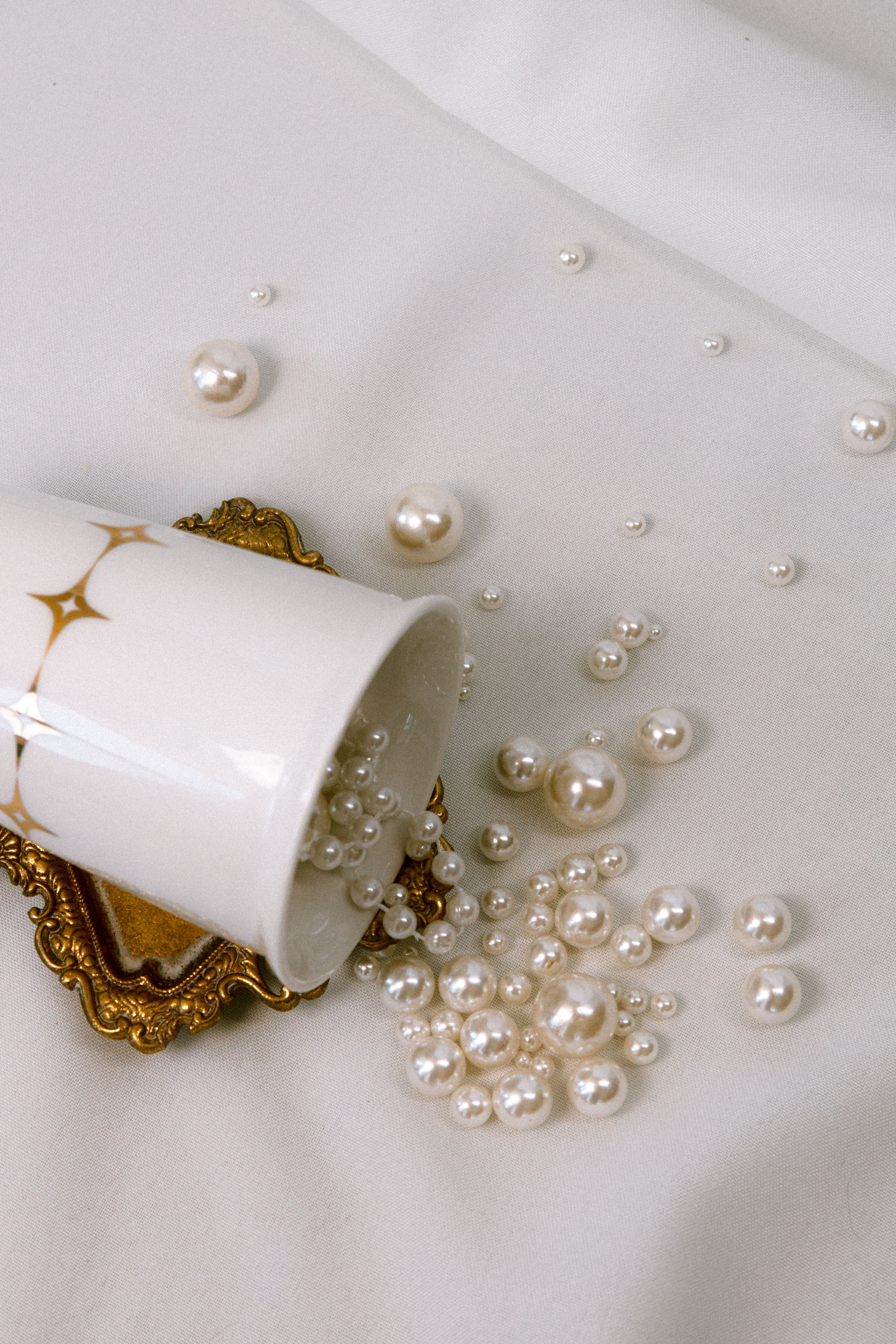 Young person wearing a green fuzzy cardigan over a light green shirt, black wide-leg pants, black shoes, and carrying a large gray quilted shoulder bag.