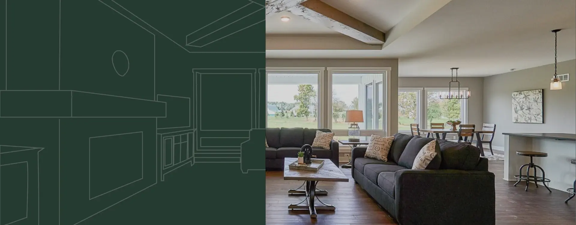 Modern living room with dark gray sofas, wooden coffee table, large windows showing a green outdoor view, a lamp on a side table, and a dining area with wooden chairs and decorative lighting in the background.