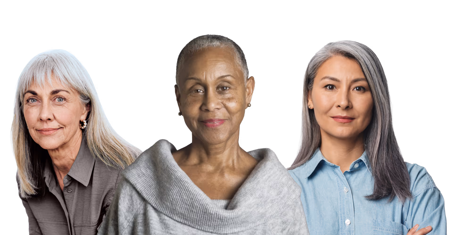 Portrait of three confident diverse older women, one with short gray hair and a gray sweater, one with long gray hair in a blue buttoned shirt, and one with long white hair in a white blouse.