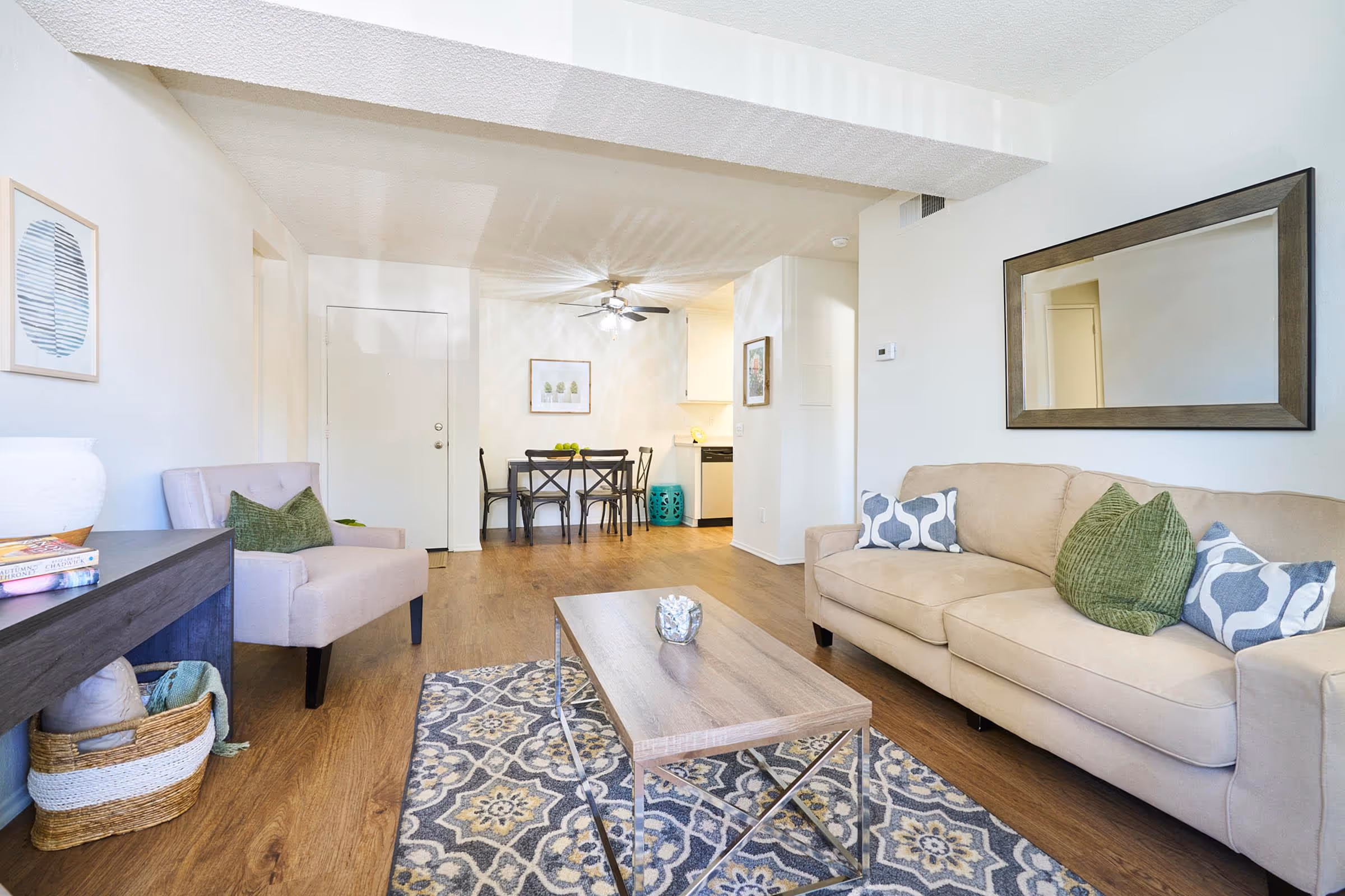 Living area with rug sofa, coffee table, and modern wall art