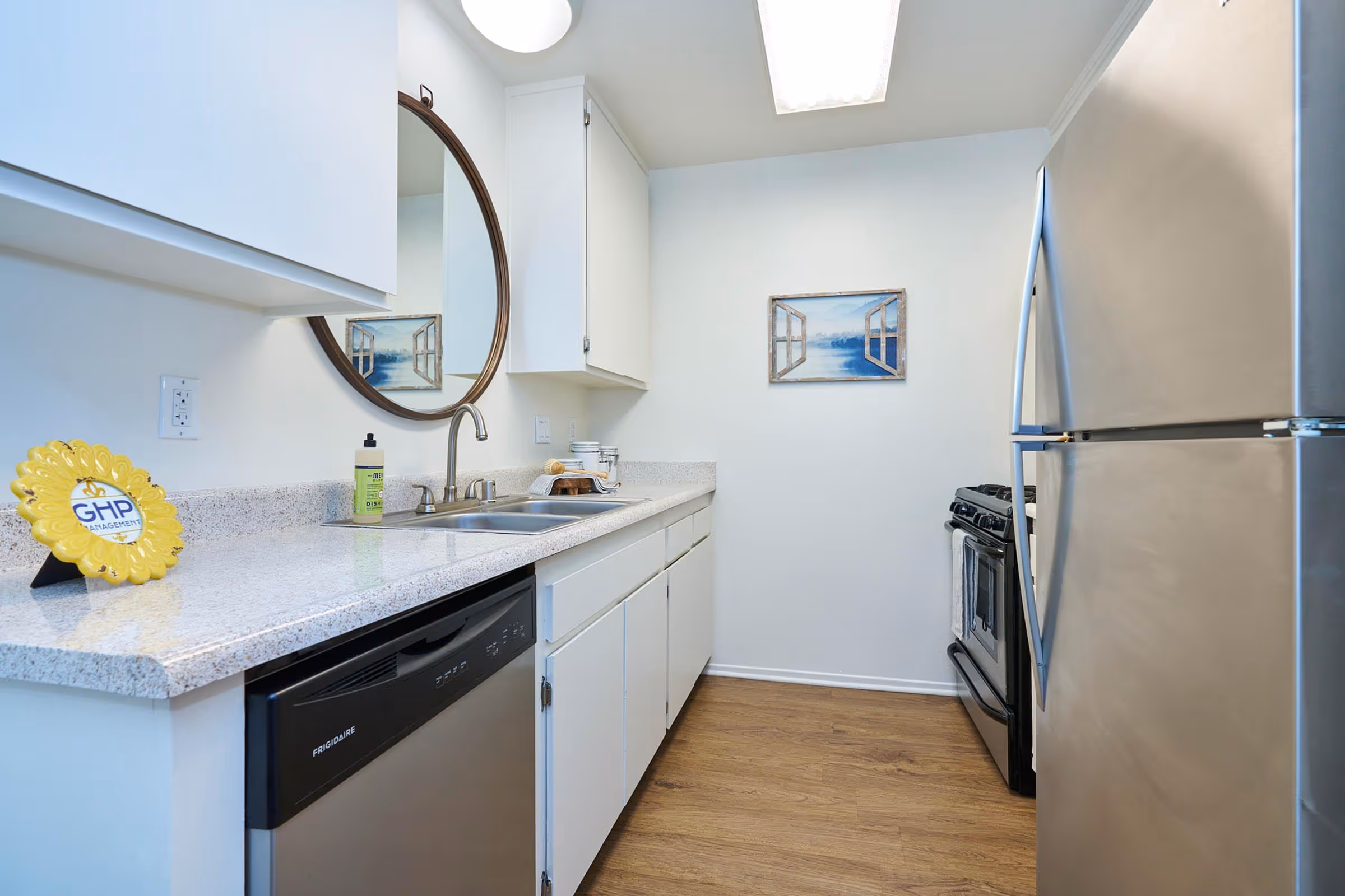 Kitchen with white cabinets and stainless steel appliances