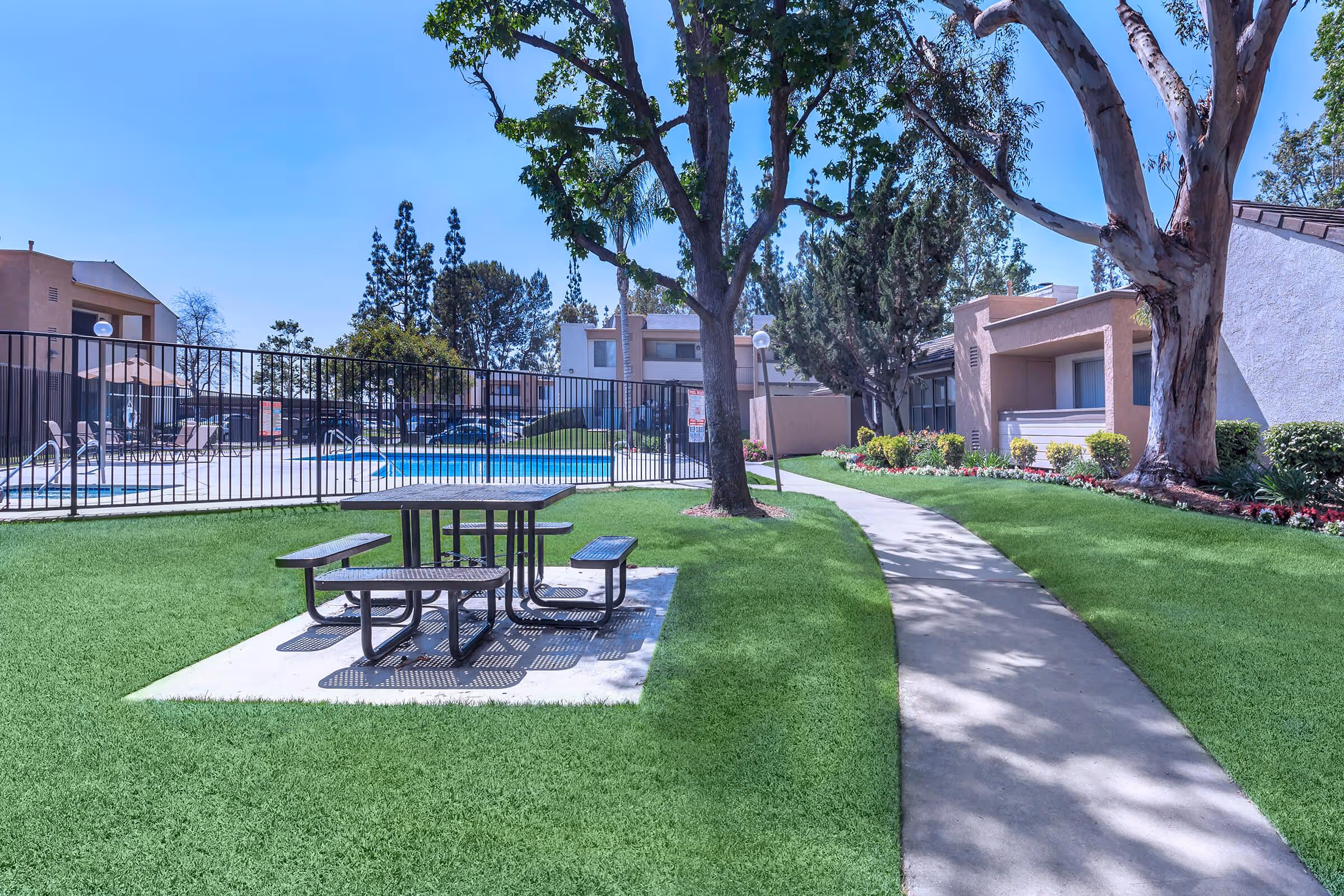 Picnic area with gated swimming pool view