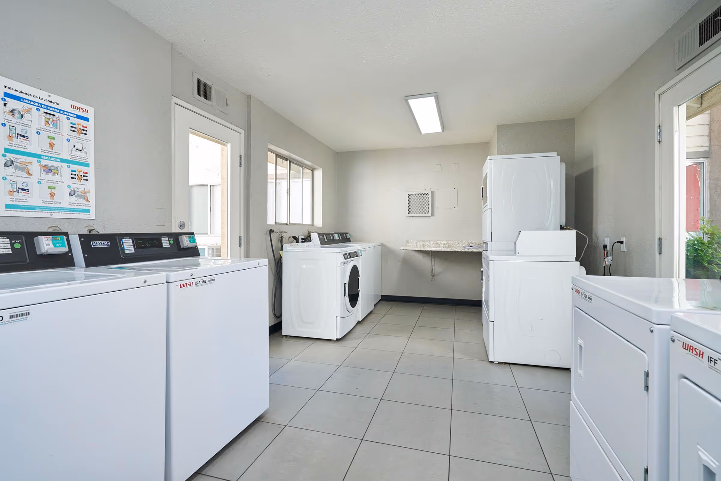 Laundry facilities with white appliances