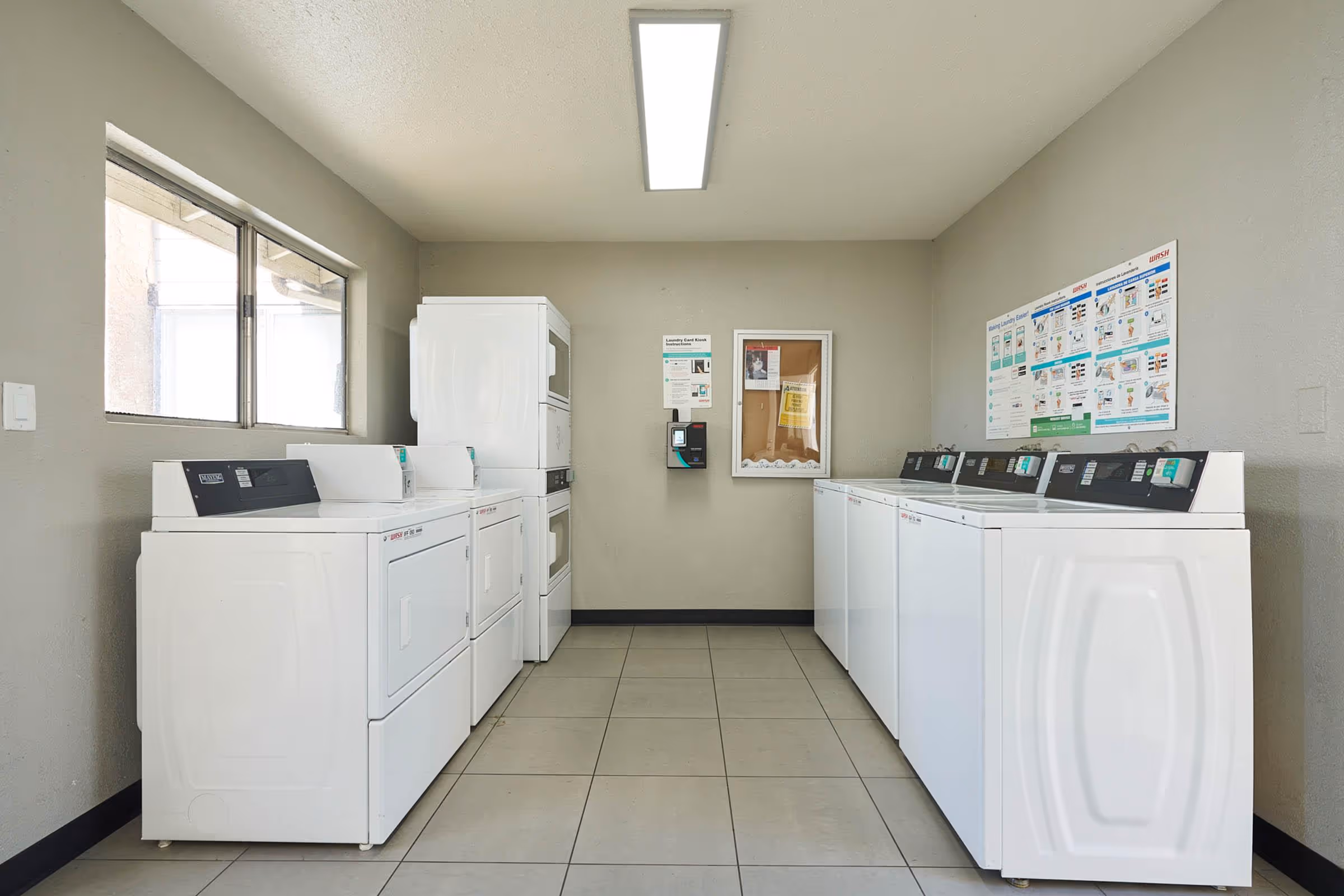Laundry facilities with white appliances