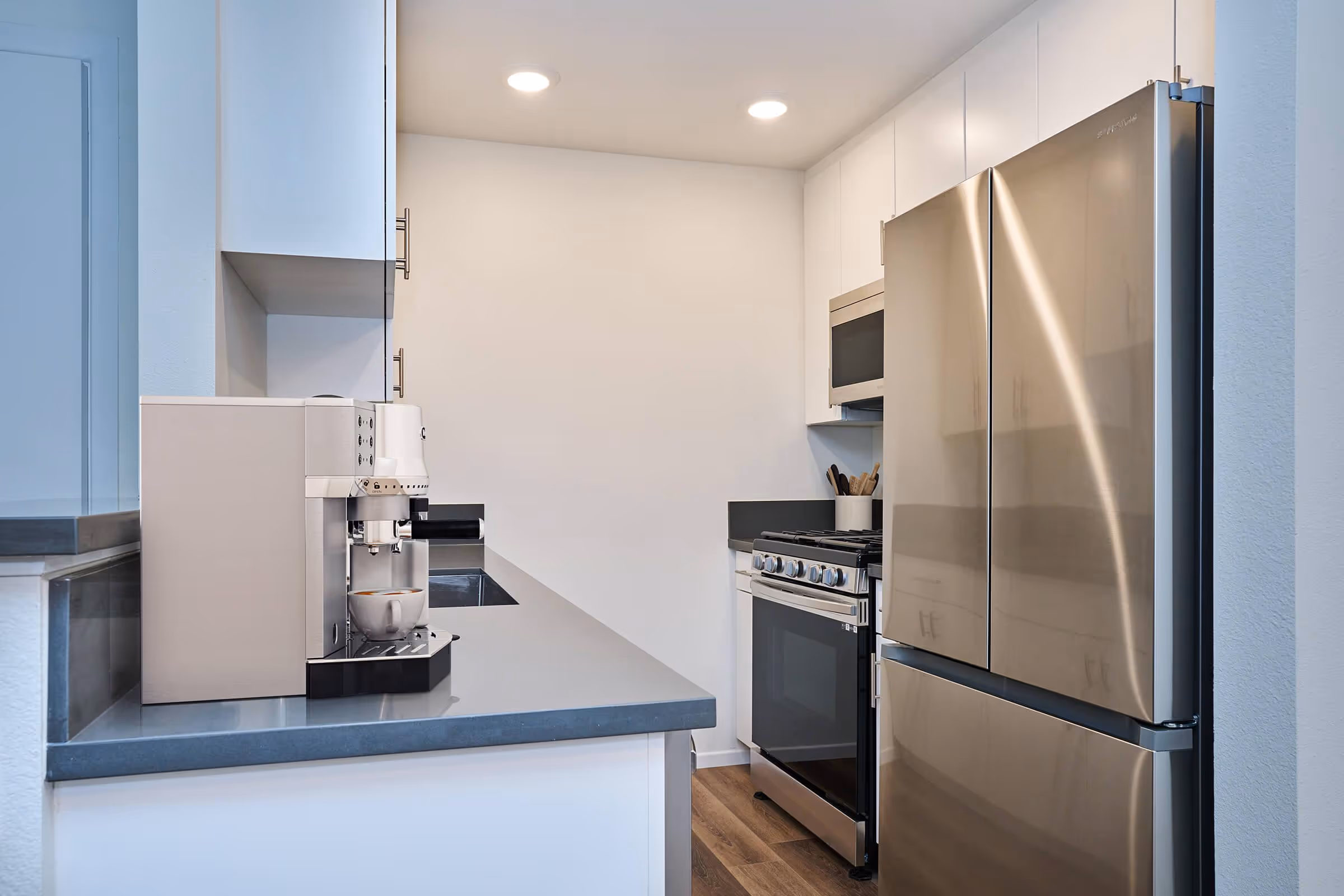 Kitchen with white cabinets and stainless steel appliances