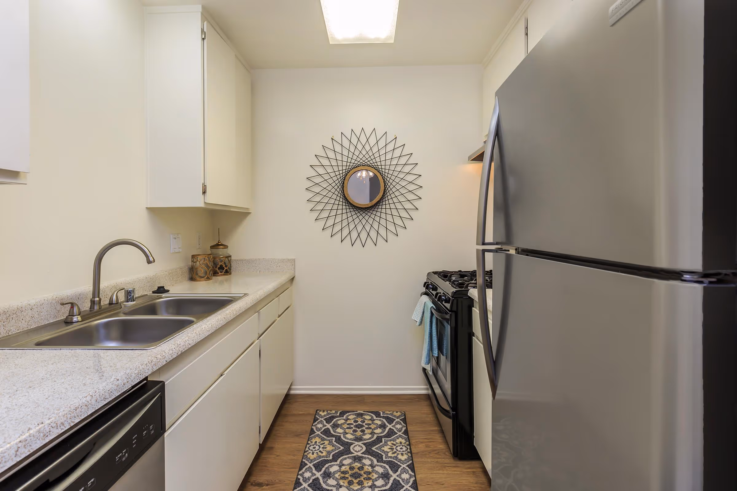 Kitchen with white cabinets and stainless steel appliances