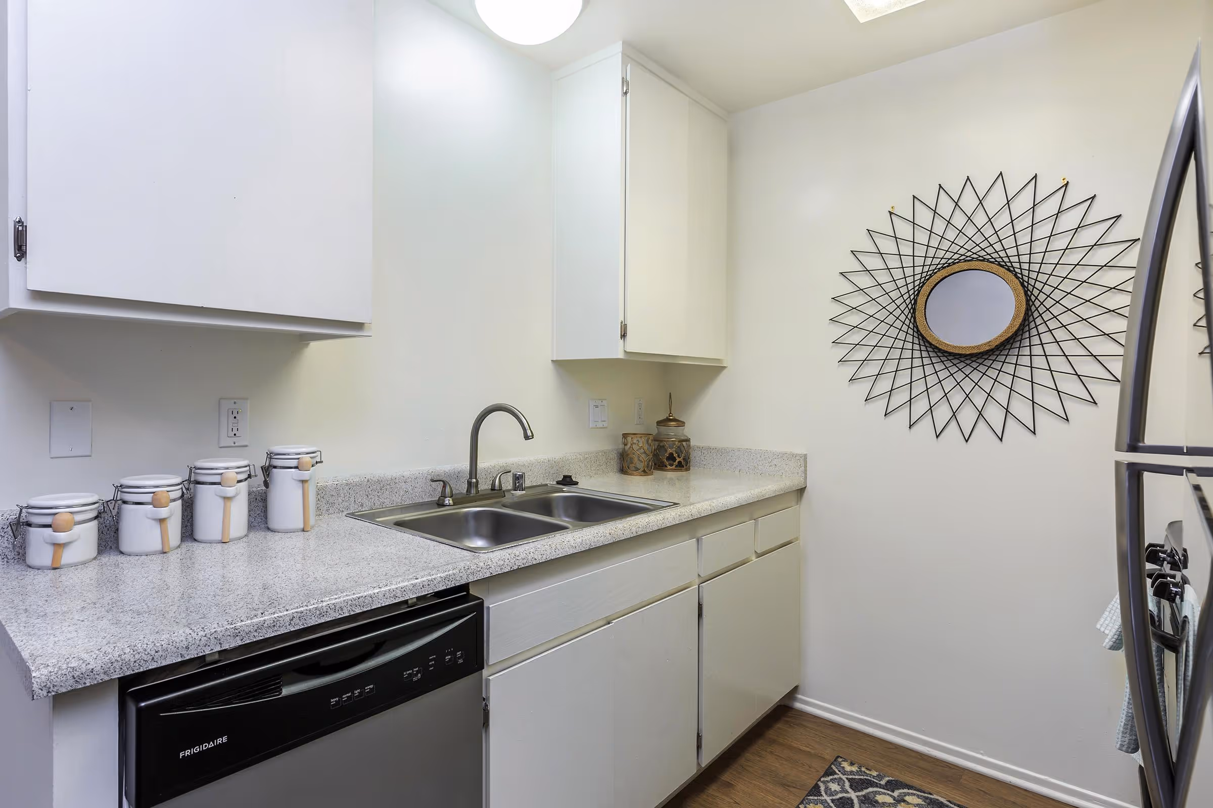 Kitchen with white cabinets and stainless steel appliances