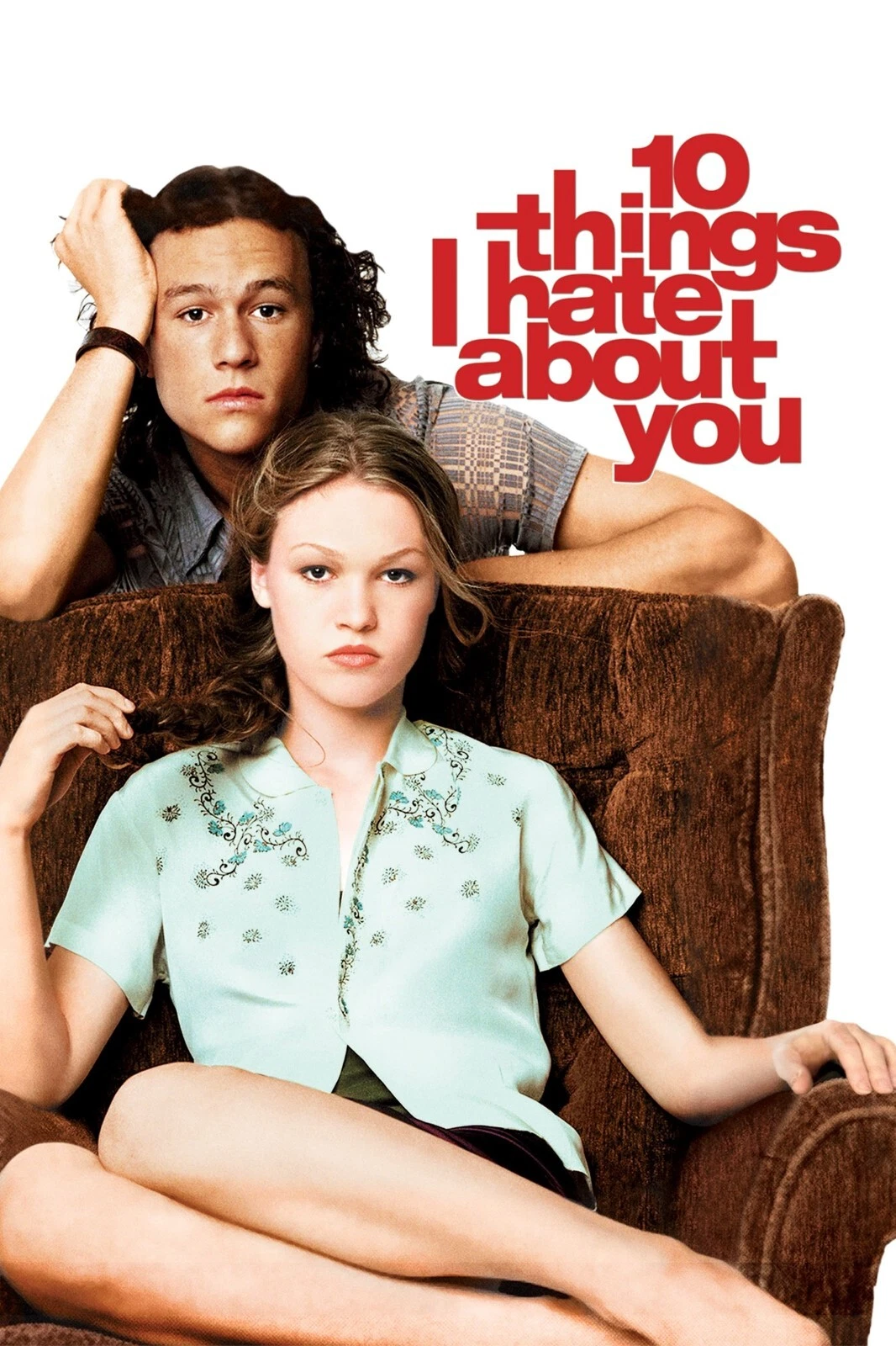 Two young adults sitting on a brown chair against a white background, with red text reading '10 things I hate about you' to the right.