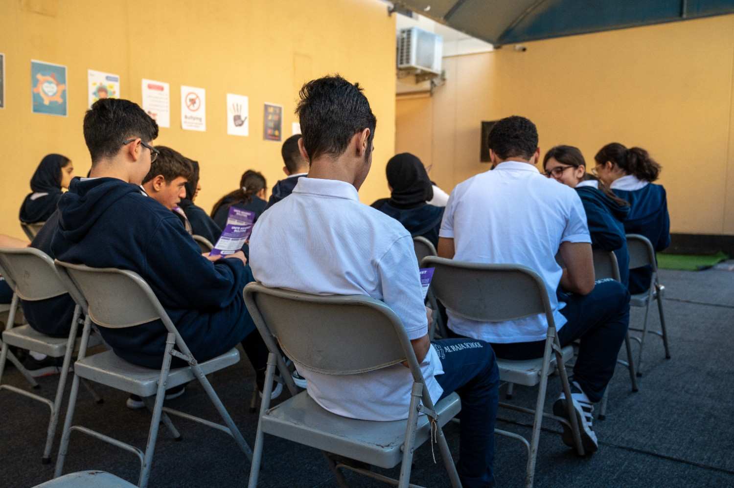 image of members collaborating on a creative project in a bright studio for a nonprofit & charity