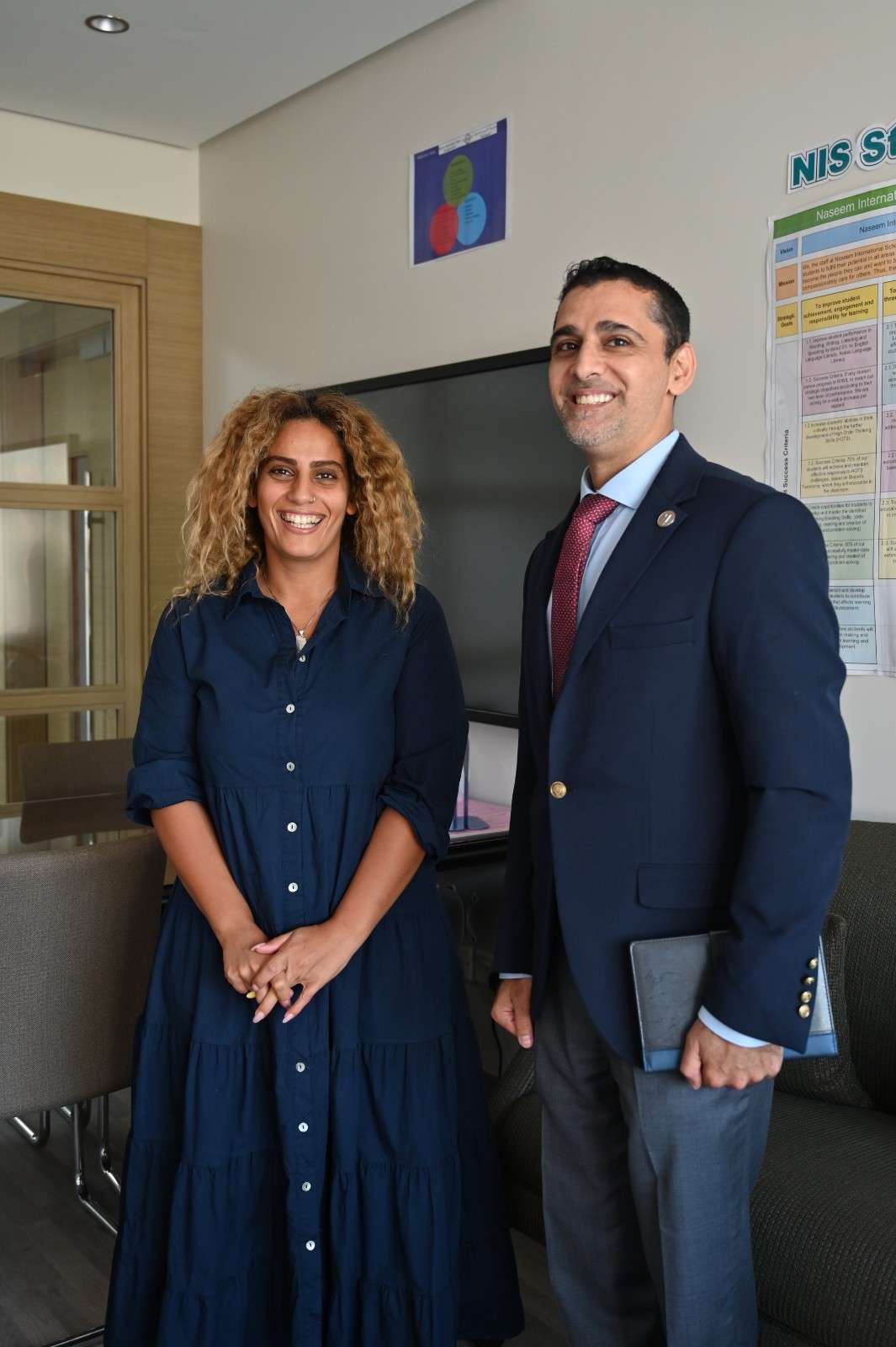 image of student holding a progress certificate