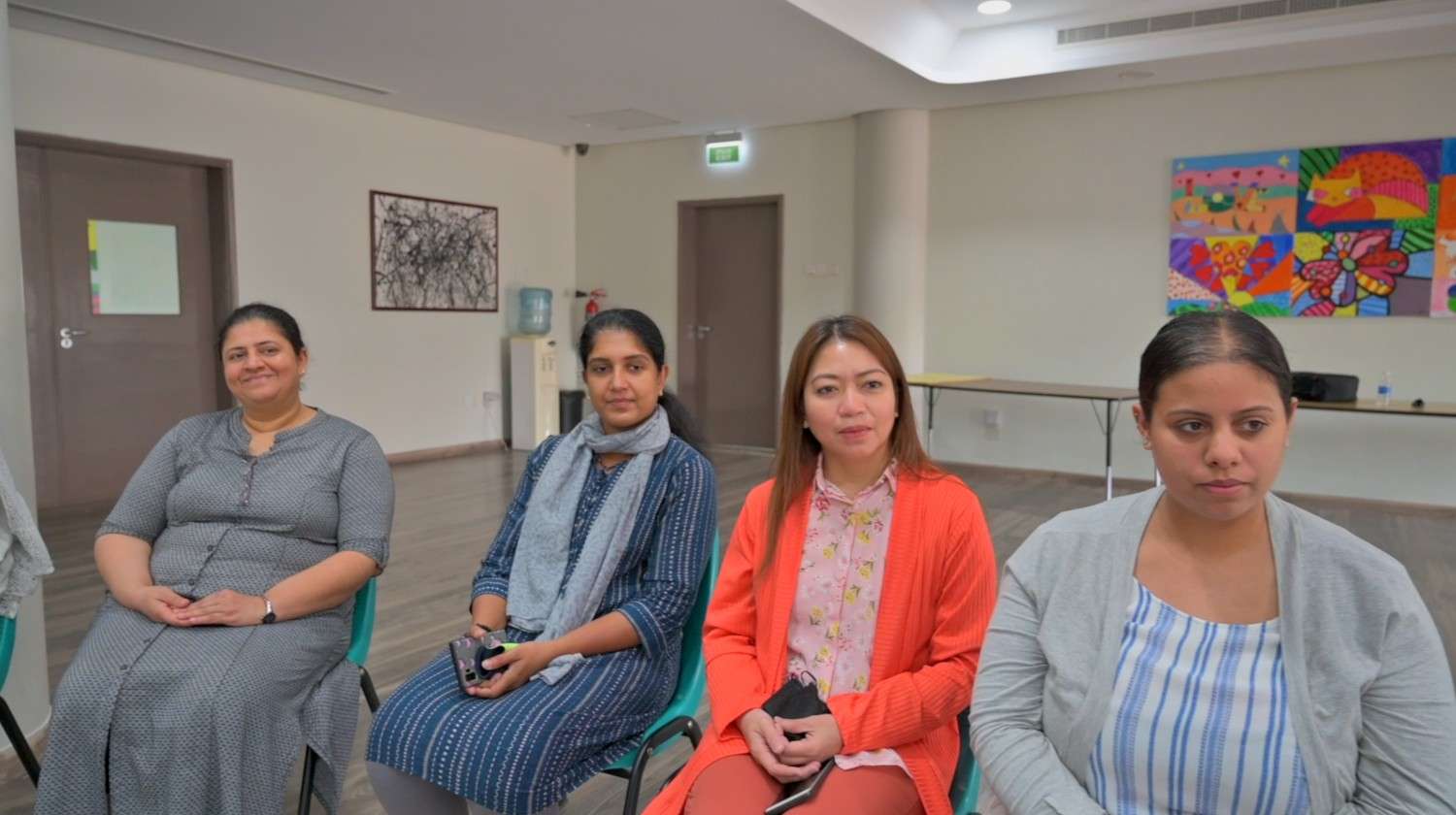 image of members collaborating on a creative project in a bright studio for a nonprofit & charity