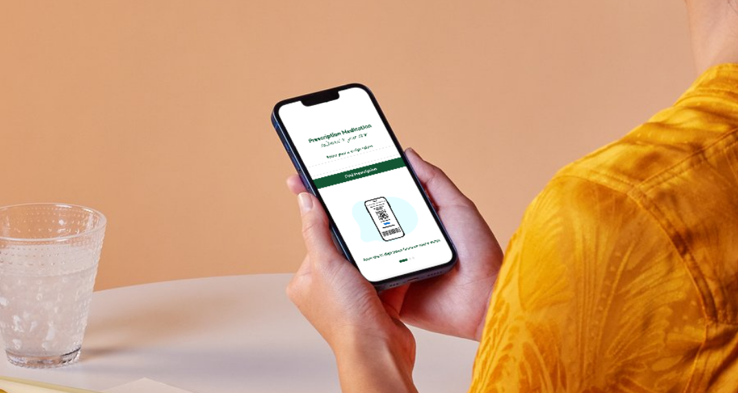 Person holding a smartphone displaying an online prescription order
