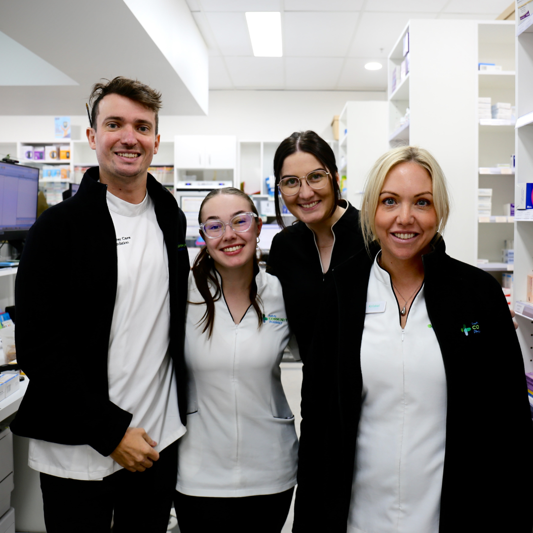 Southcity Community Pharmacy dispensary technician team smiling together in the dispensary