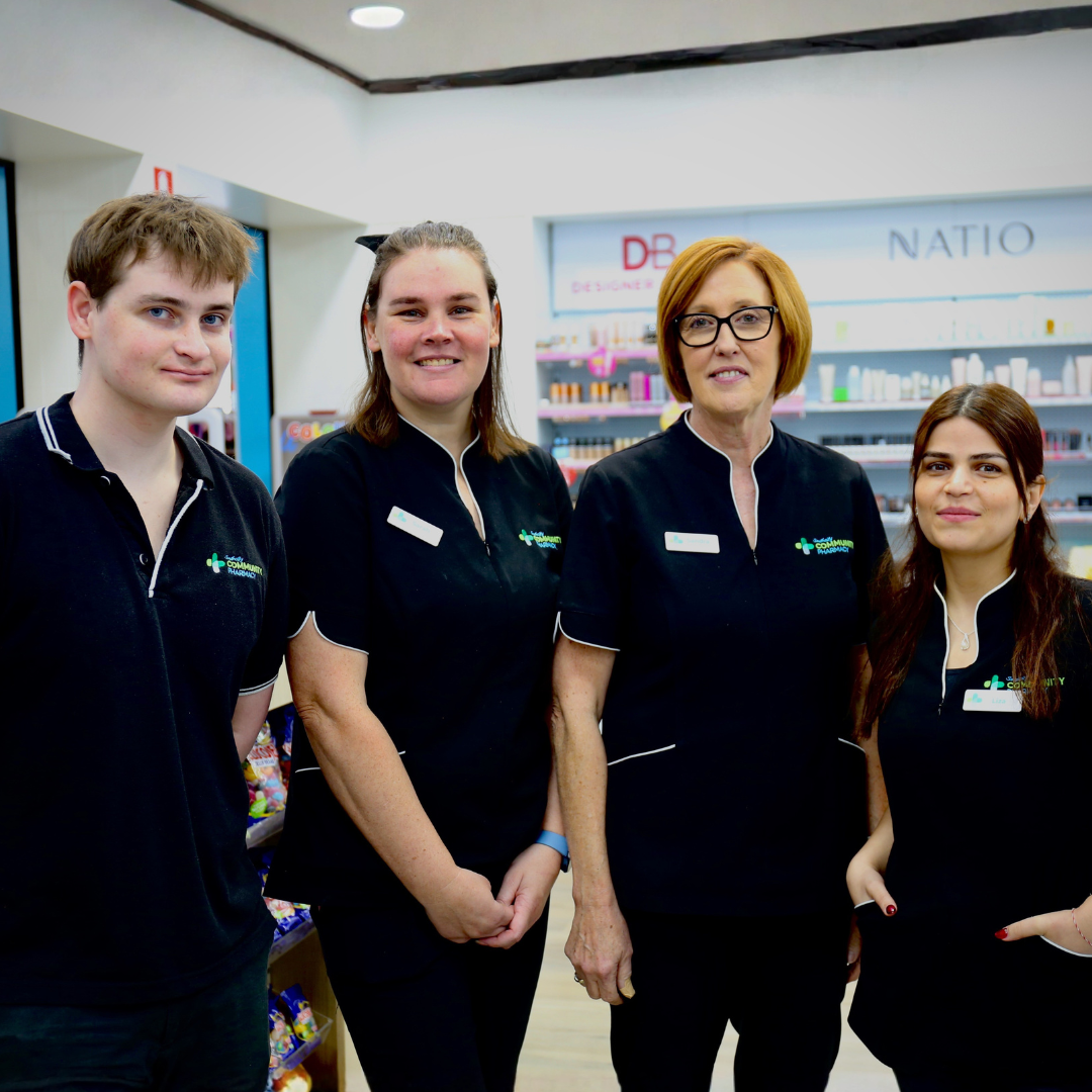 Southcity Community Pharmacy assistants team standing together in store, ready to help customers