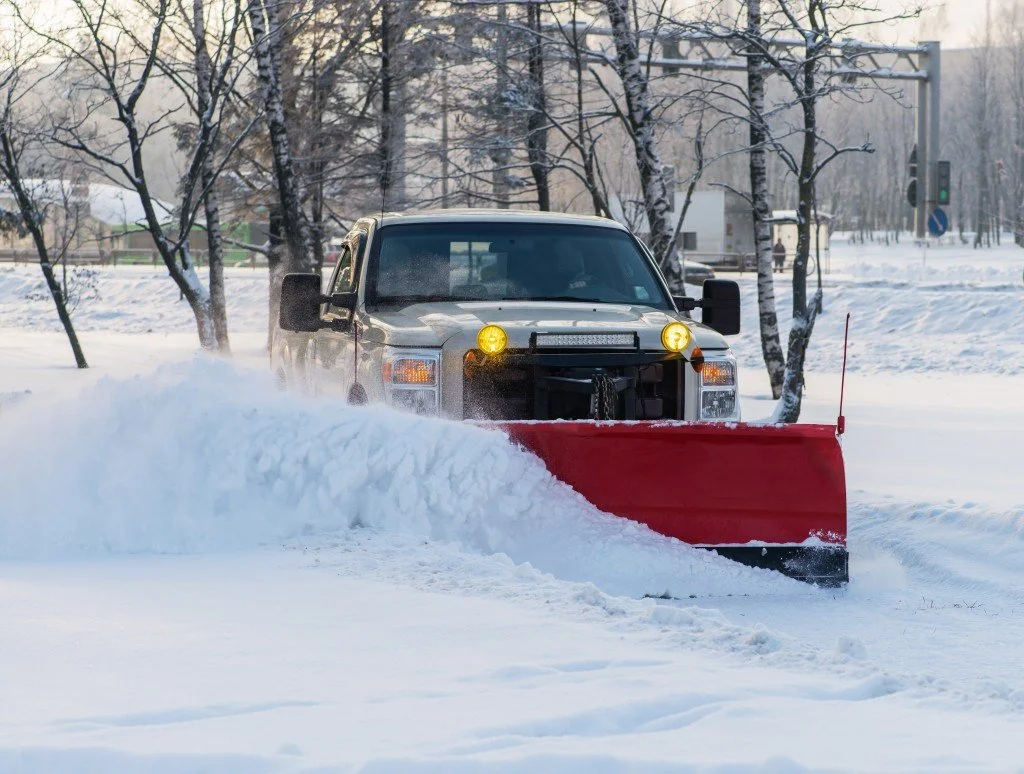 Snowmasters truck completing snow removal services