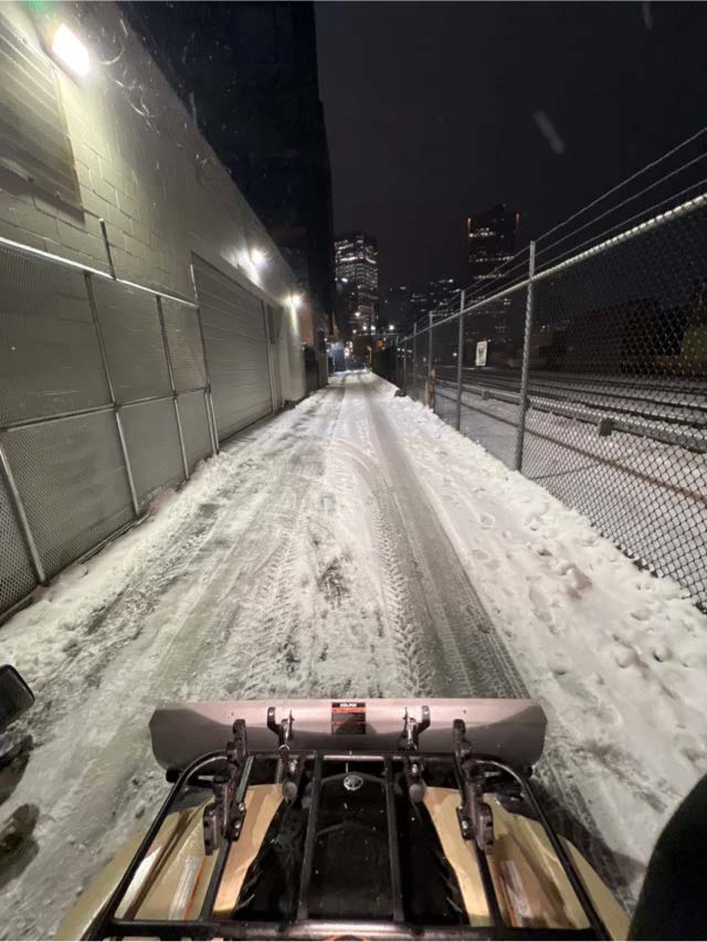 ATV snow plow clearing a property access area in Chilliwack