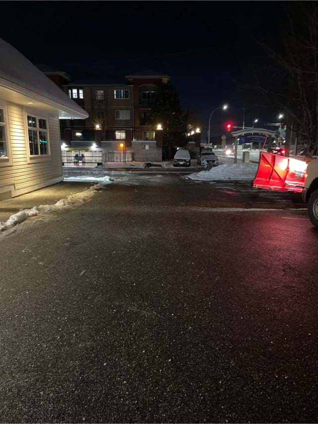 Salt and ice melt applied to a walkway in Chilliwack for ice prevention