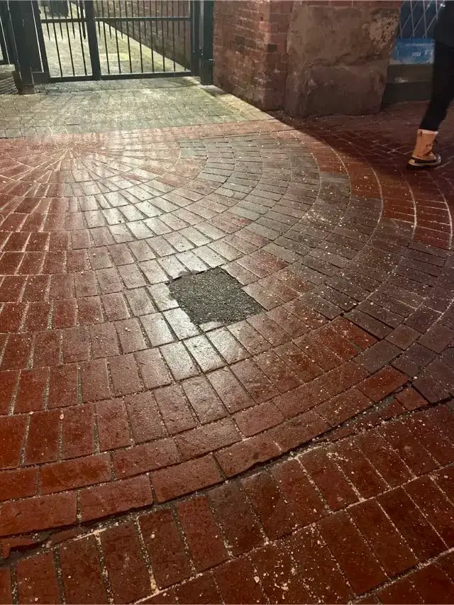 Salt and ice melt applied to a Gastown walkway for ice prevention