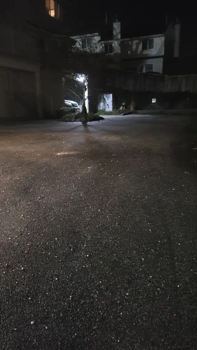 De-icing material applied to a strata drive lane and visitor parking area in Eagle Ridge, Coquitlam
