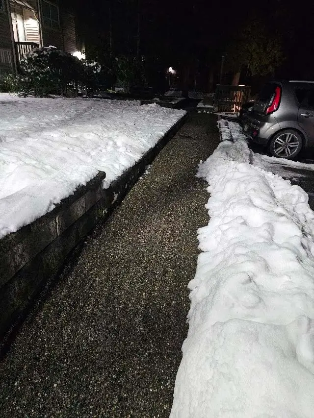 Cleared and de-iced pedestrian walkway at a strata property in Coquitlam Town Centre