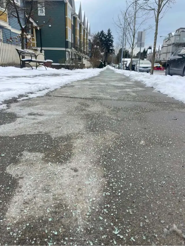 De-iced sidewalk at a strata townhouse complex in South Surrey after snow clearing and ice management services.