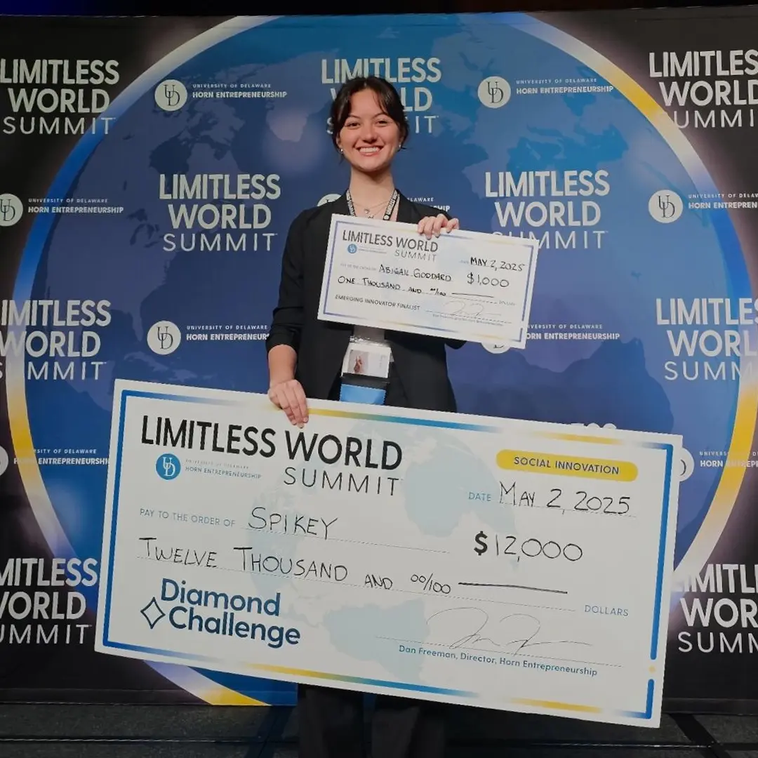 Abigail Goddard, Leangap Class of 2024, holding her Diamond Challenge prize check at the Limitless World Summit