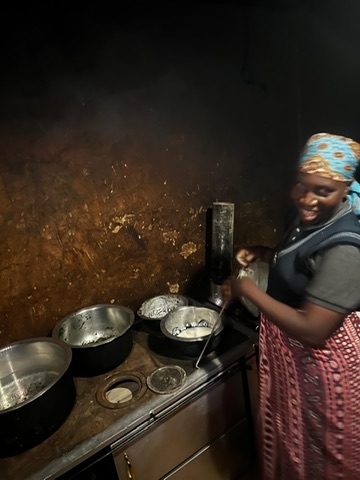The cook preparing a meal at UNITAS