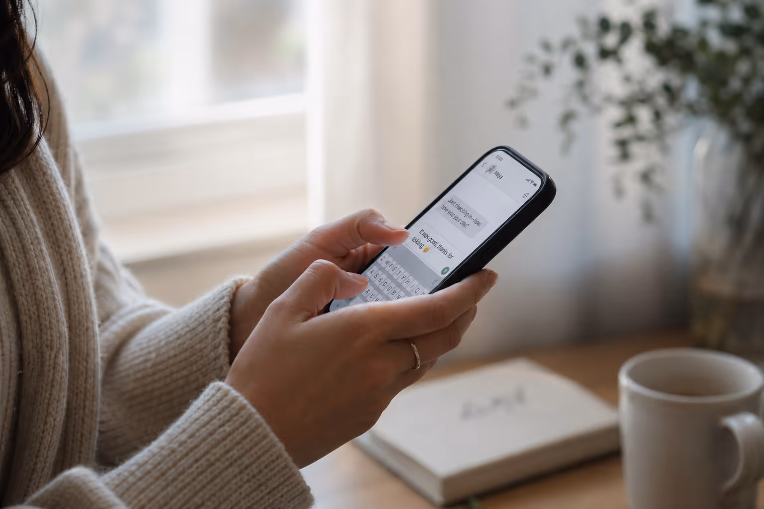 A person reading messages on their phone while connecting with a local host