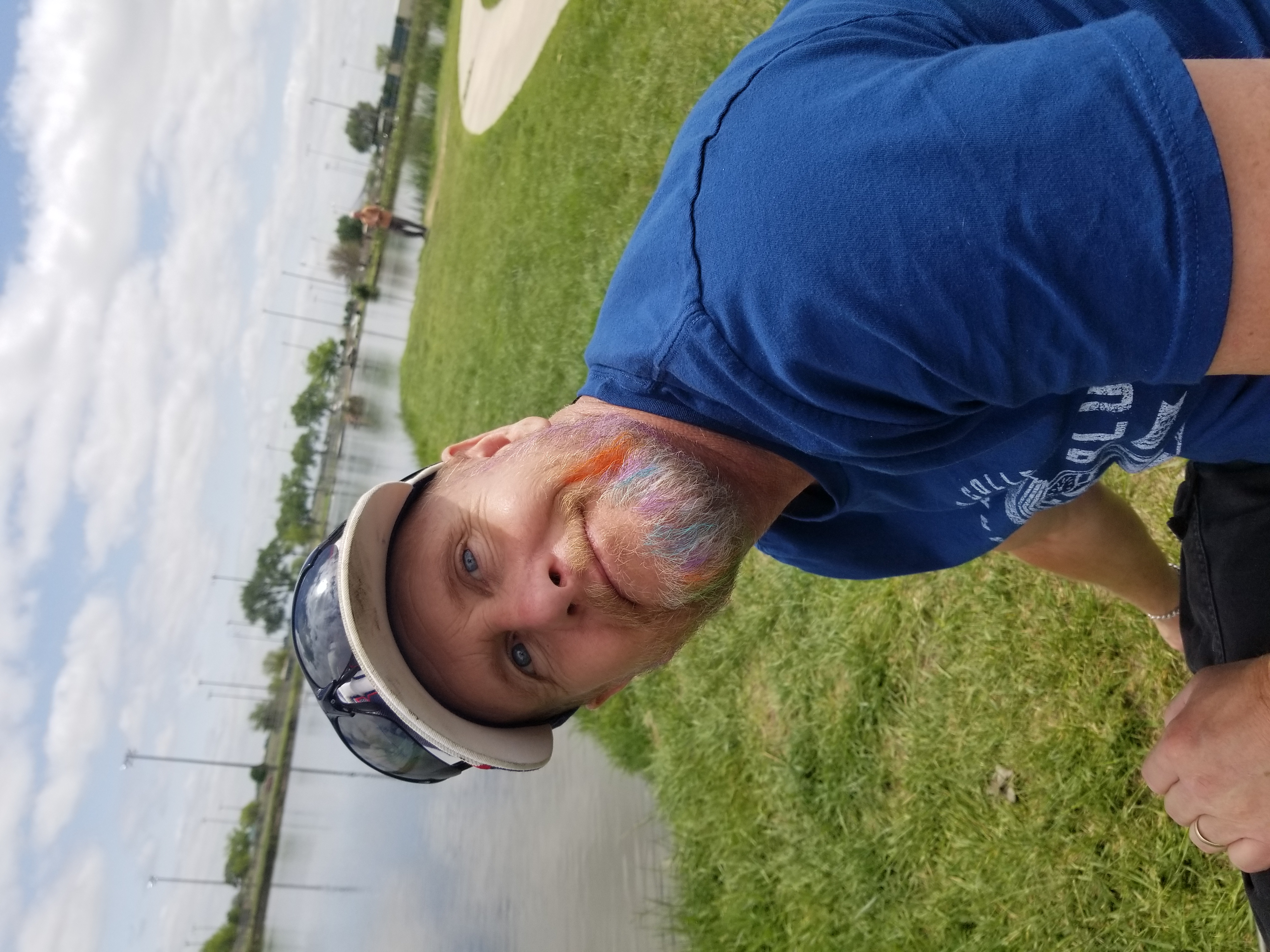 Dad at the lake with rainbow beard paint