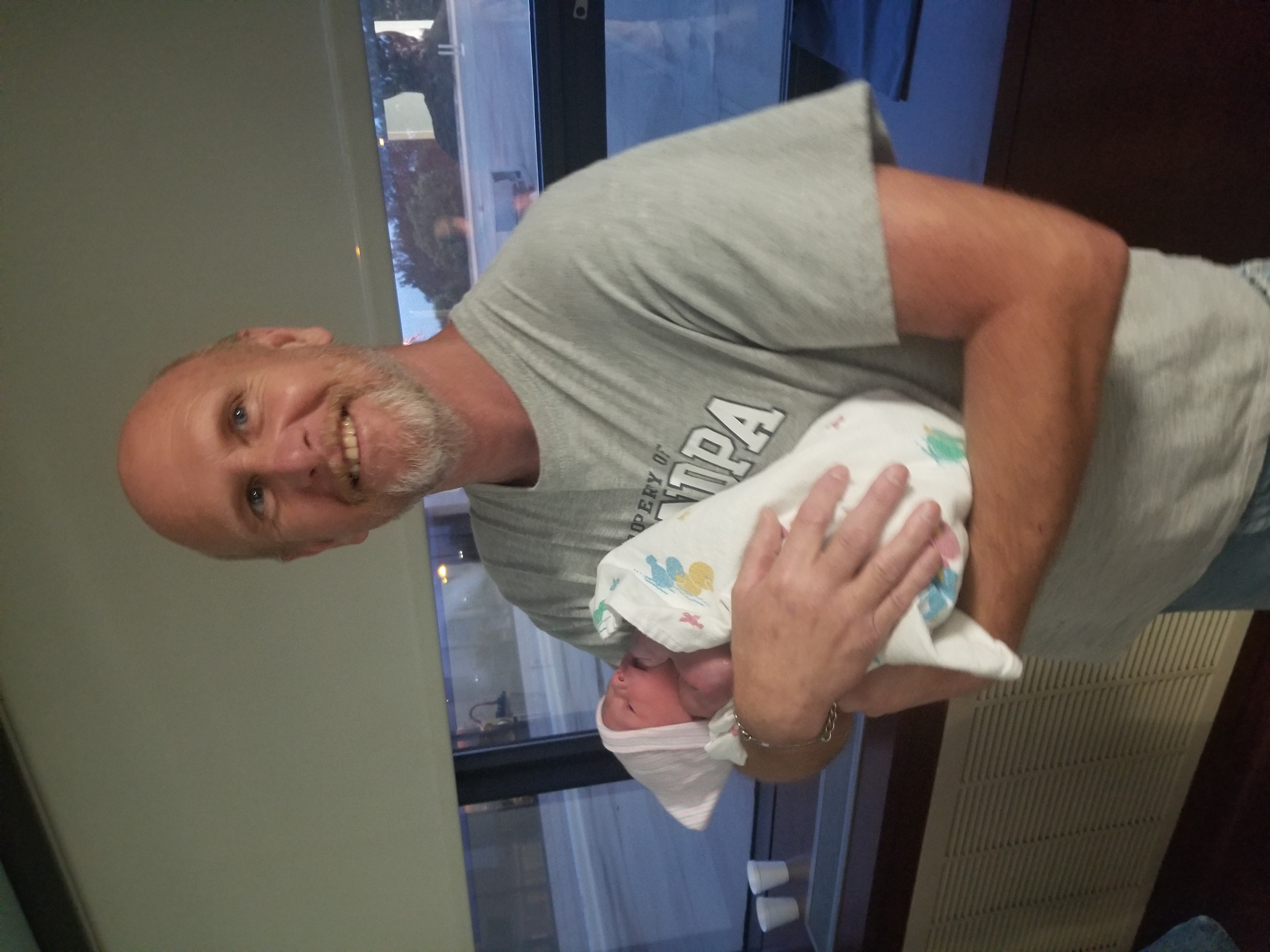 Dad holding his grandson for the first time — Property of Grandpa shirt