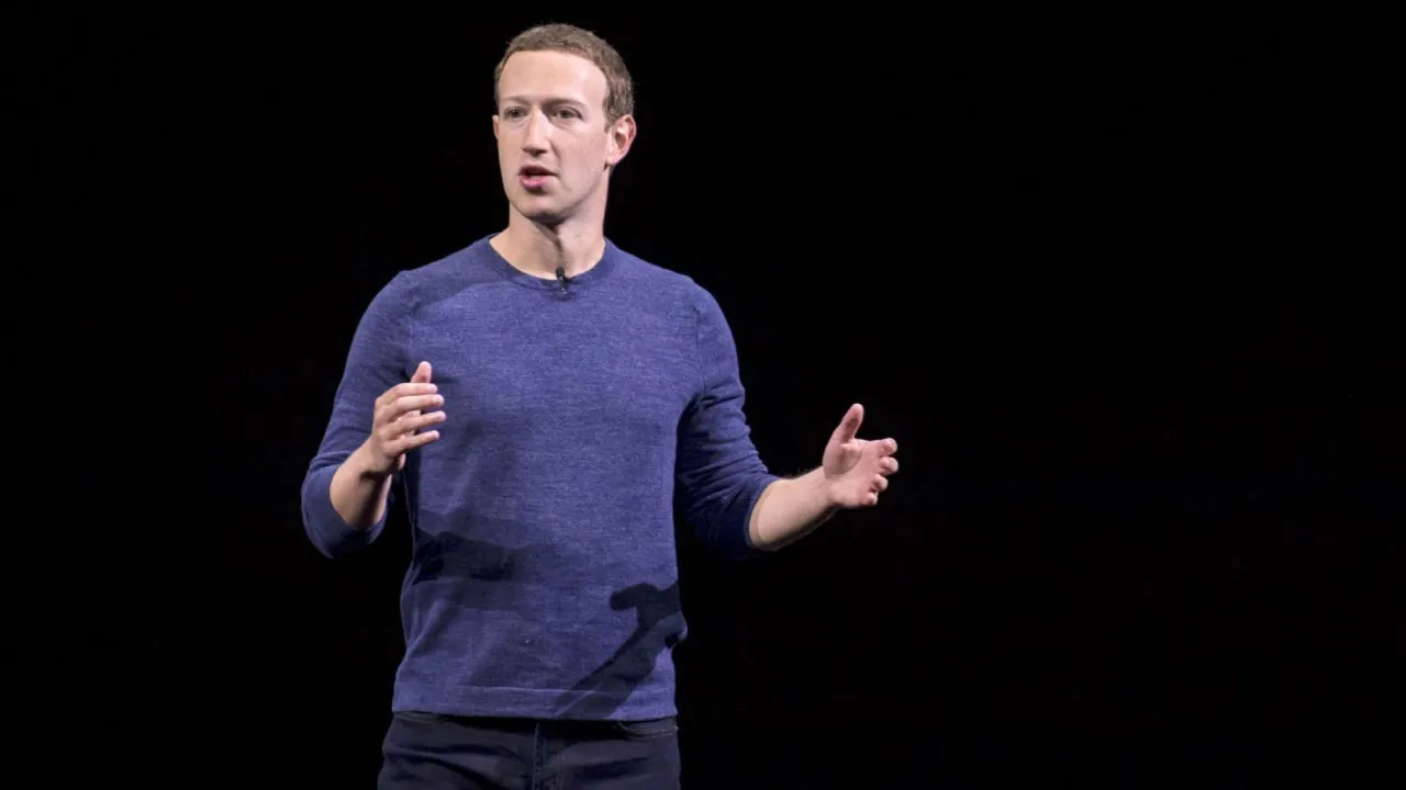 Mark Zuckerberg, founder of Facebook giving a speech on black background.