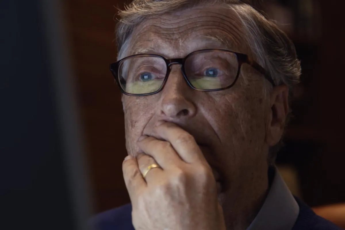 Bill Gates working on his computer late at night.